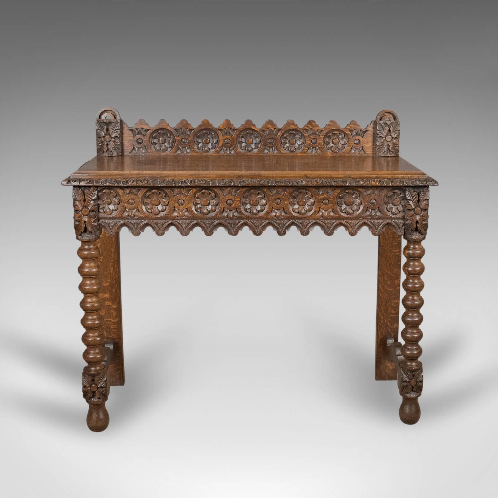 This is an antique console table from the 19th cenrtury, Scottish with carved oak decoration dating to circa 1880.

A handsome console table displaying good color and grain interest
Attractive wisps of medullary rays shine through the quality