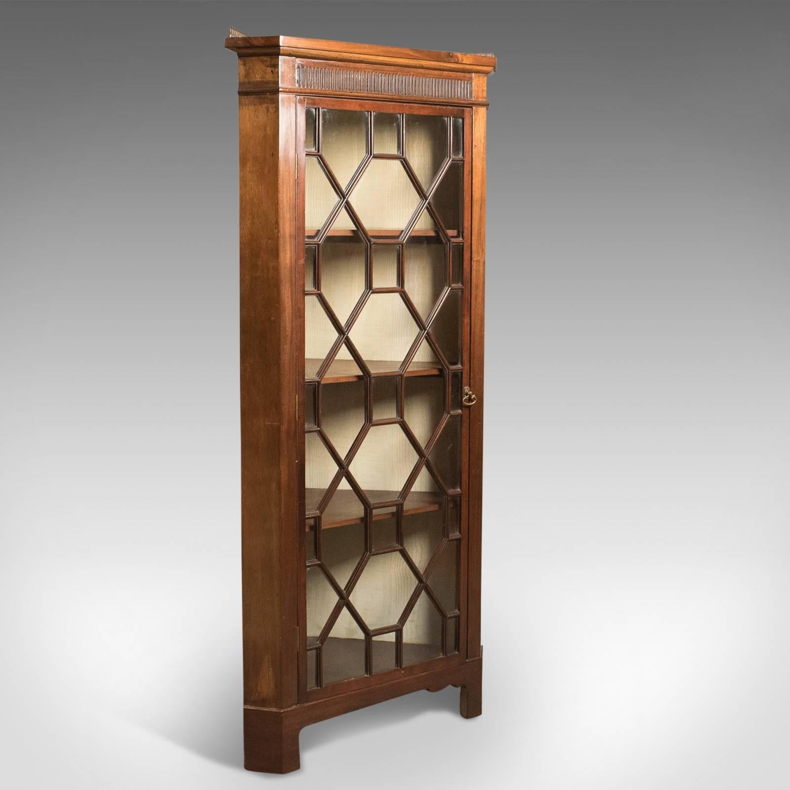 This is an Edwardian antique glazed display corner cabinet, English dating to circa 1910.

Standing just under 5 feet tall this delightful cabinet is in first class order
In mahogany with a deep rich lustre in the wax polished finish
Of good