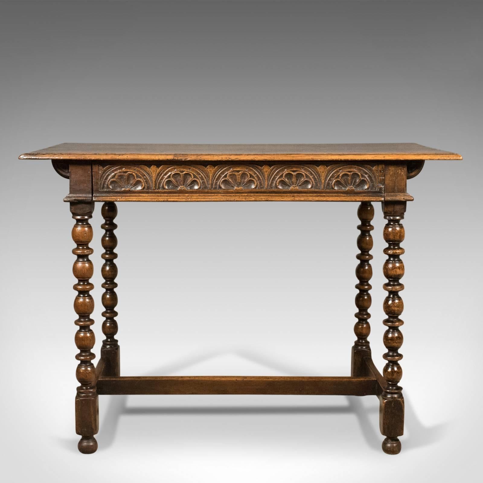 This is a Georgian antique side table in English oak and dating to the 18th century, circa 1780.

Joined English oak with good color and desirable aged patina
Plank top with grain interest and simple edge moulding
Single frieze drawer decorated