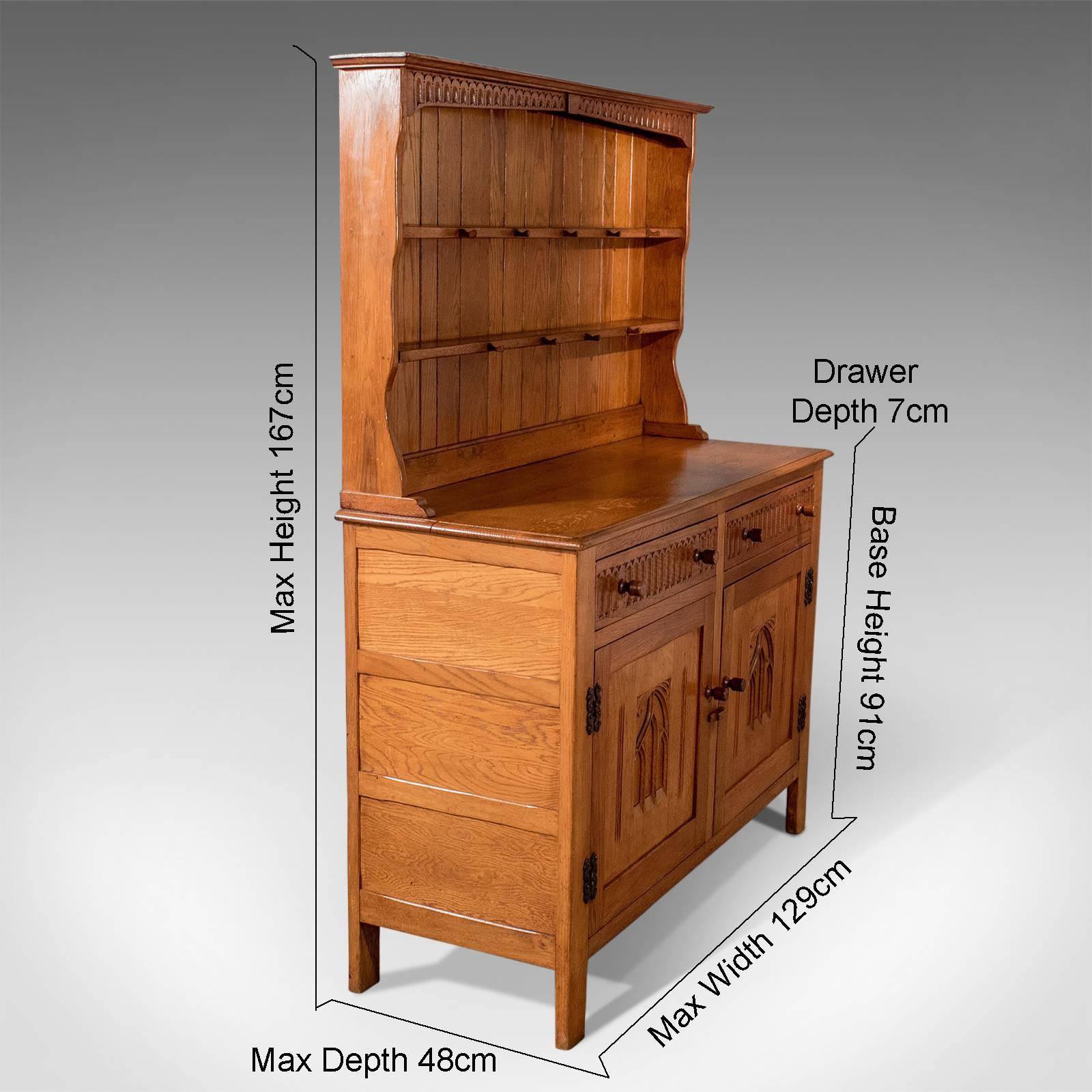 A most pleasing kitchen dresser presented in very good antique condition
With Classic Tudor overtones to this well crafted item of functional display furniture
Skilfully crafted by the noted English maker Webber - creators of fine oak furniture