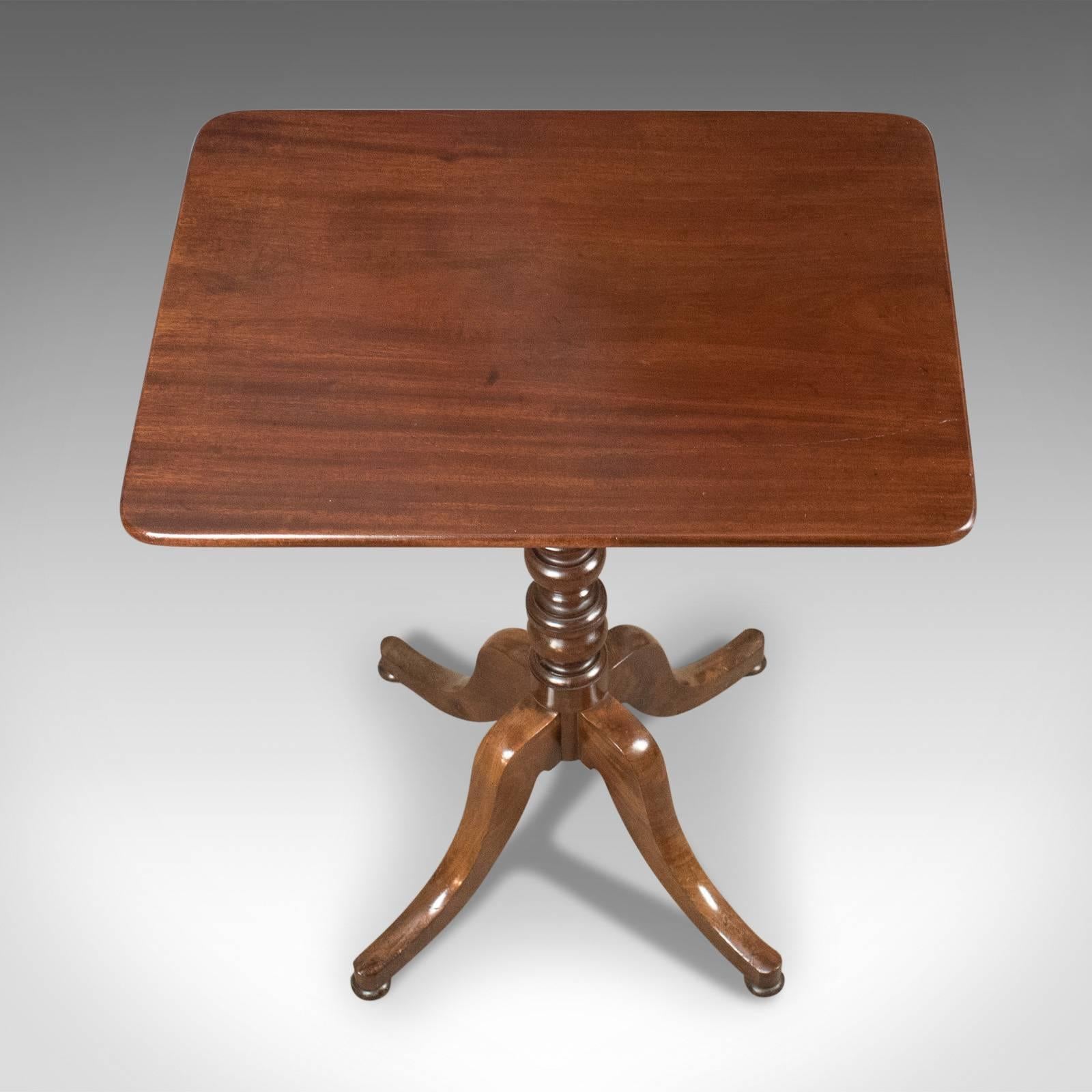 This is an antique wine table in mahogany from the end of the Victorian era. An English side table dating to circa 1900.

Good proportions and color
Tabletop displaying well and featuring subtle rounded corners
Raised on a ring turned stem
Over