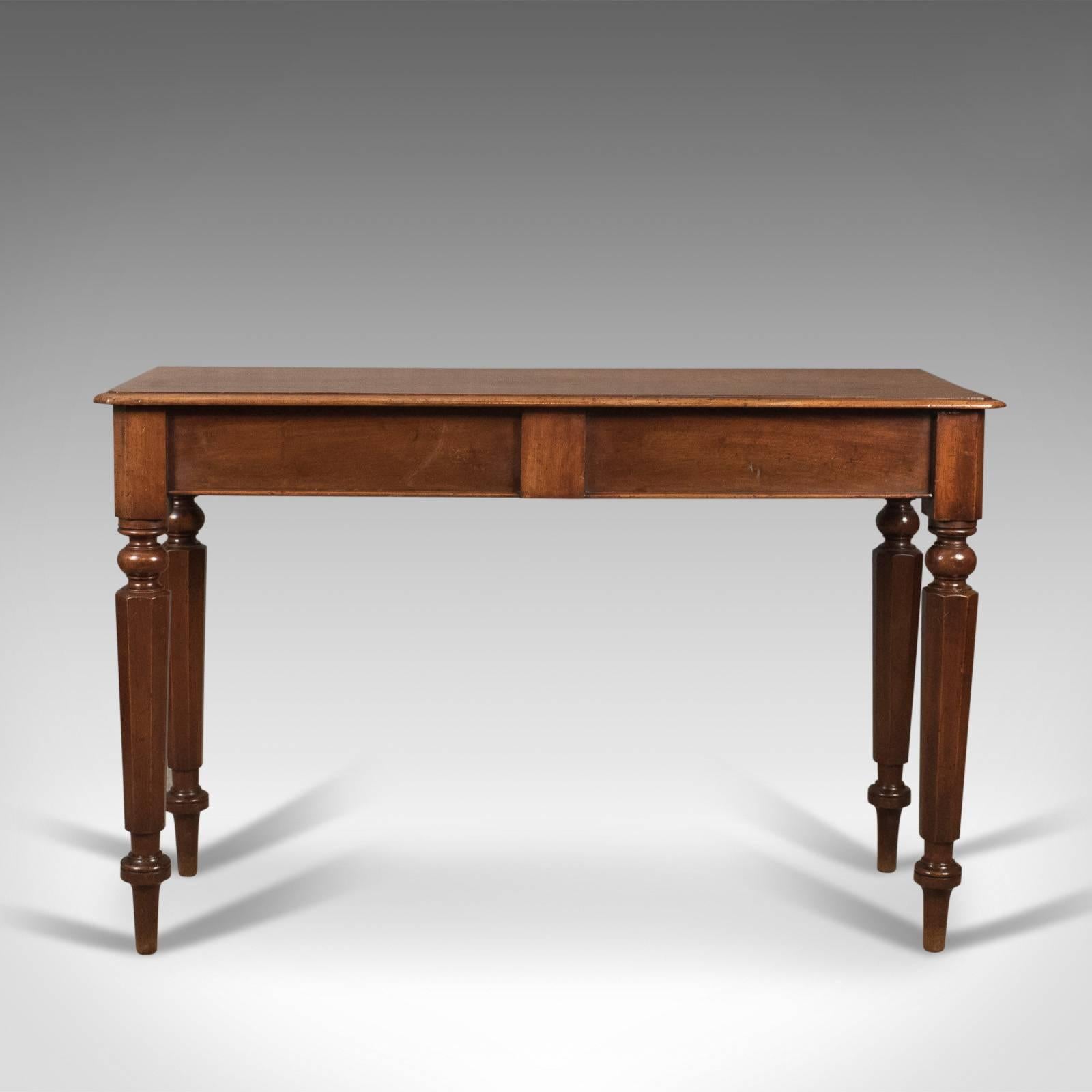 This is an antique console table. An English piece in mahogany and dating to the Regency period of the 19th century, circa 1820.

An attractive hall console table in fine cuts of mahogany
Good color with a desirable aged patina

The top