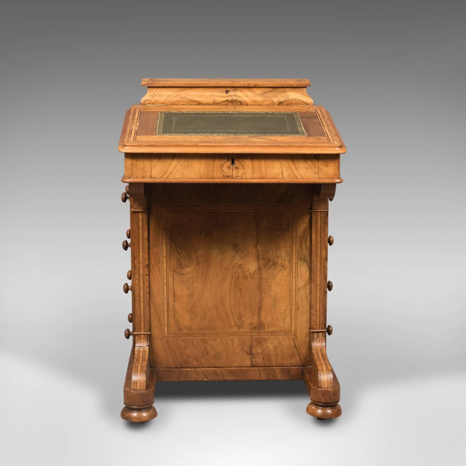 This is a Victorian antique Davenport in burr walnut. An English desk, dating to circa 1850.

Attractive grain interest in the well figured burr walnut
Light honey tones in a polished wax finish
Highlighted with subtle crossbanding in ebony and