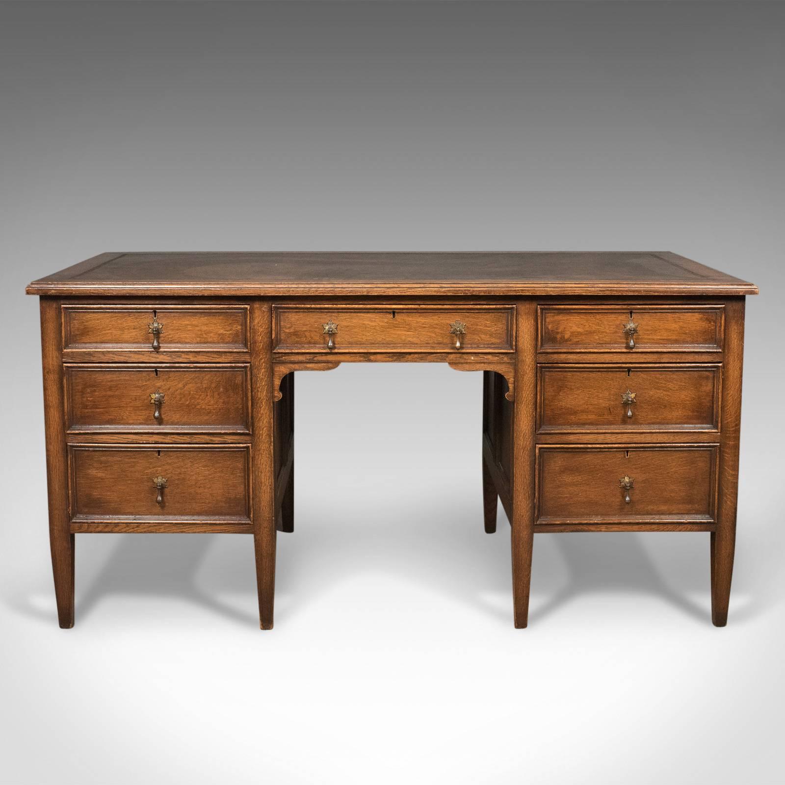 This is a 1930s vintage oak desk by Maggs & Co of Bristol. An English pedestal library table.

Period and original in very good order throughout
The oak with mellow honey tones in a waxed finish
Blind tooled, Rexine inset writing surface

Banks
