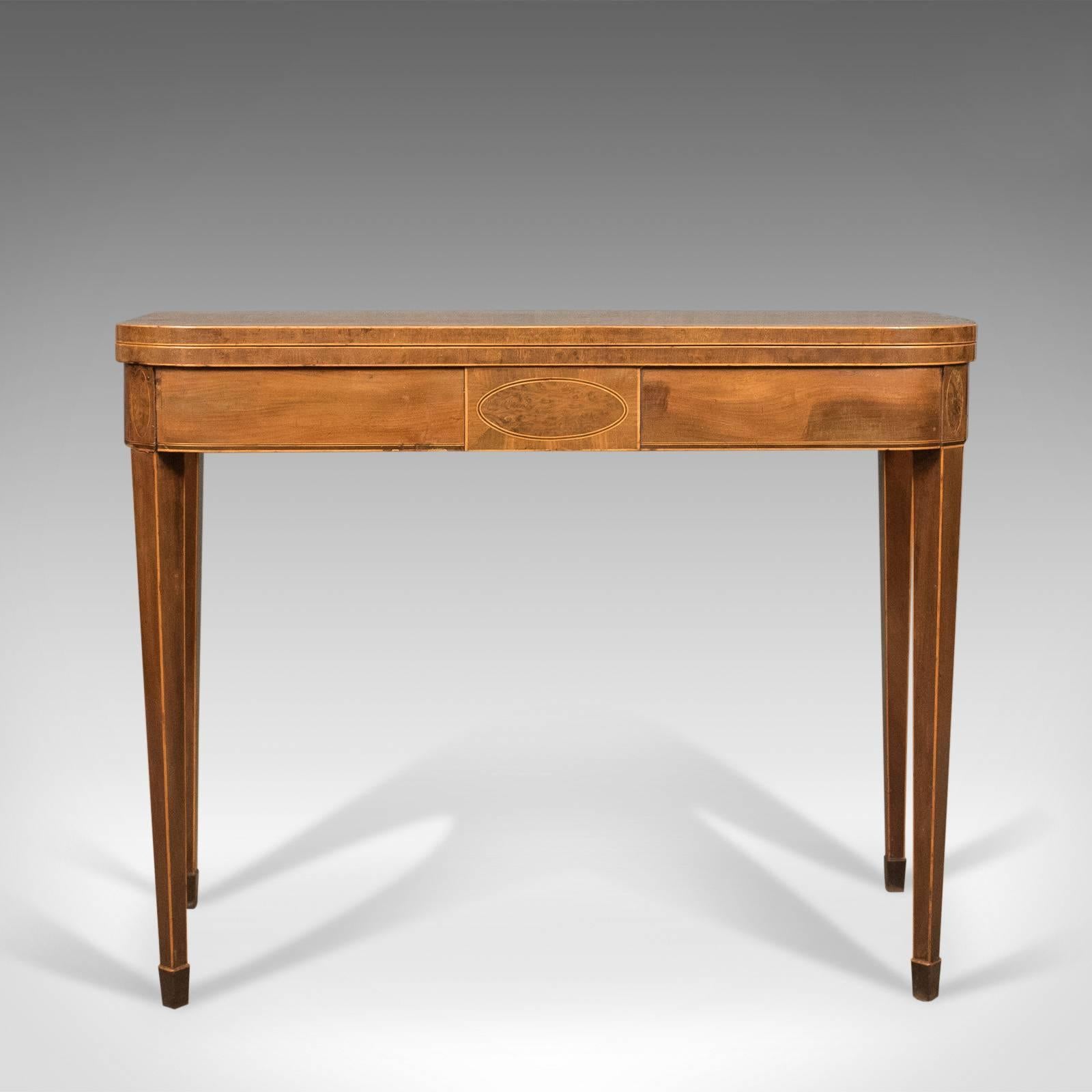 This is an antique fold-over tea table in thuya wood. A late Georgian, English piece dating to the late 18th century circa 1780.

Rare to find and displaying beautifully
Attractive 'bird's-eye' grain detail in a wax polished finish
Good color