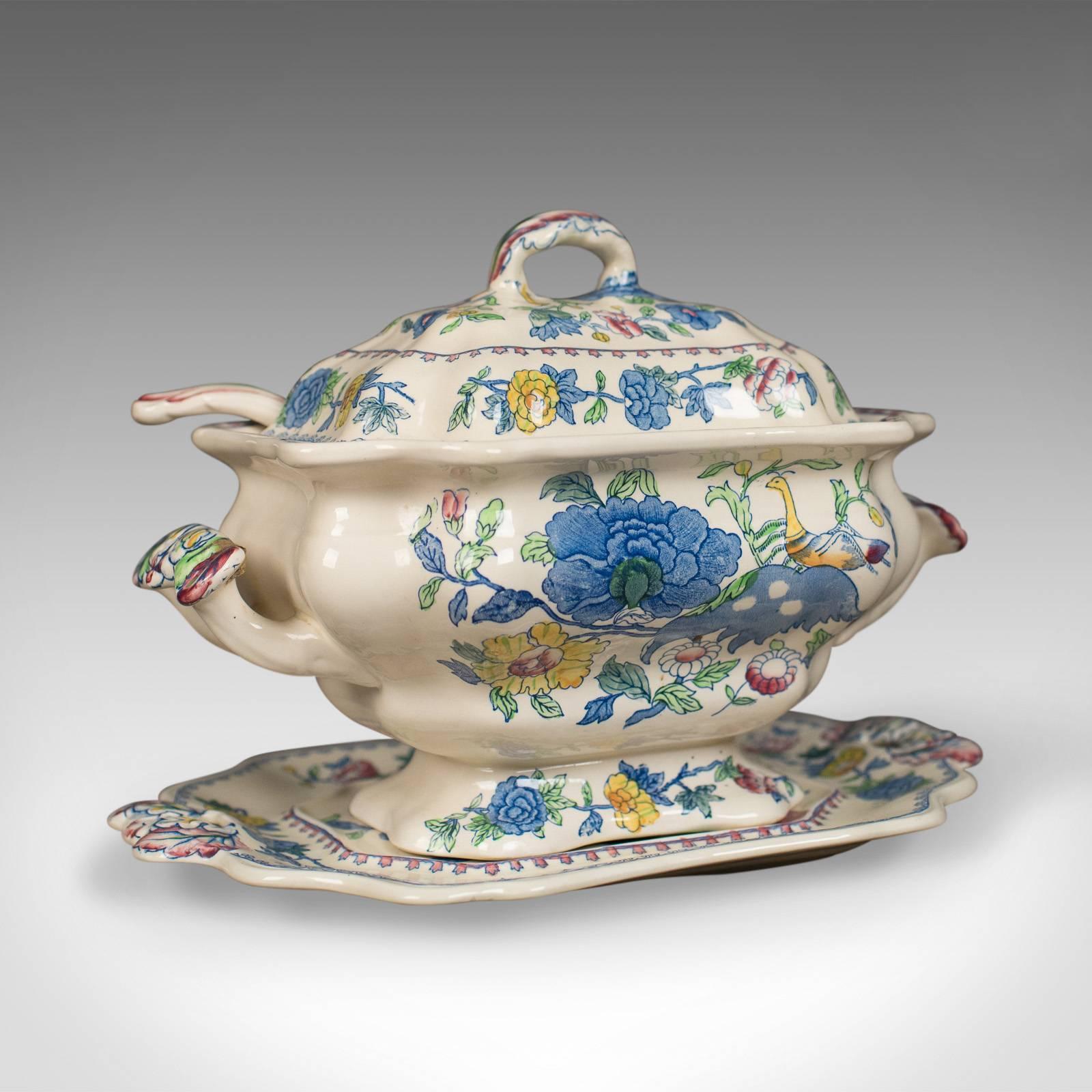 This is a 'Mason's Ironstone China' soup tureen, under-plate and ladle in the Regency design, dating to circa 1940.

In very good condition, free-from any chips or marks
Bright colours to the attractive floral design
Complete with ladle and
