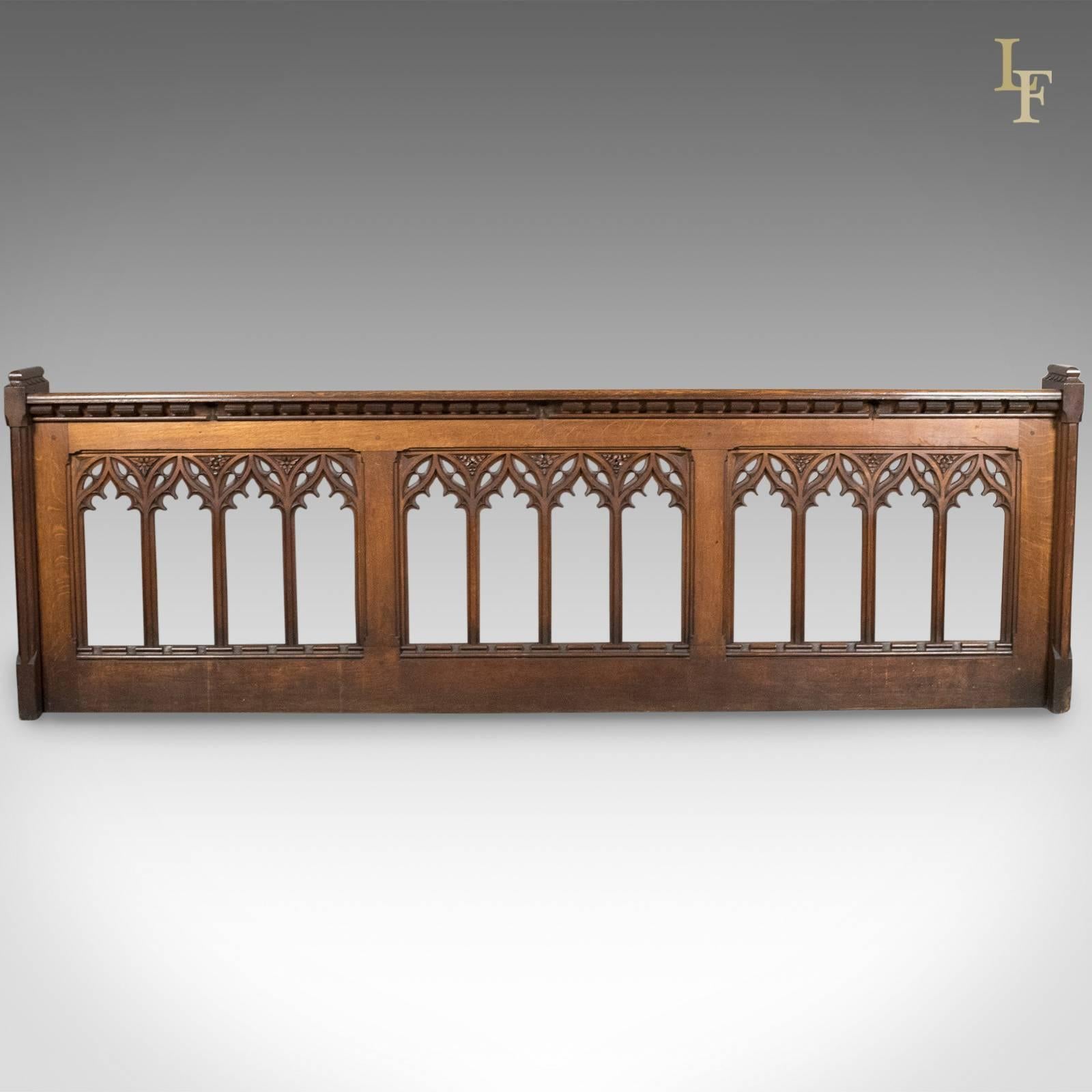 This is an antique pew front, a Victorian gothic choir stall in English oak with Pugin overtones, circa 1880.

Superbly carved and in fine order
Golden hues to the well figured oak
Robust and sturdy with a variety of uses

An ecclesiastical