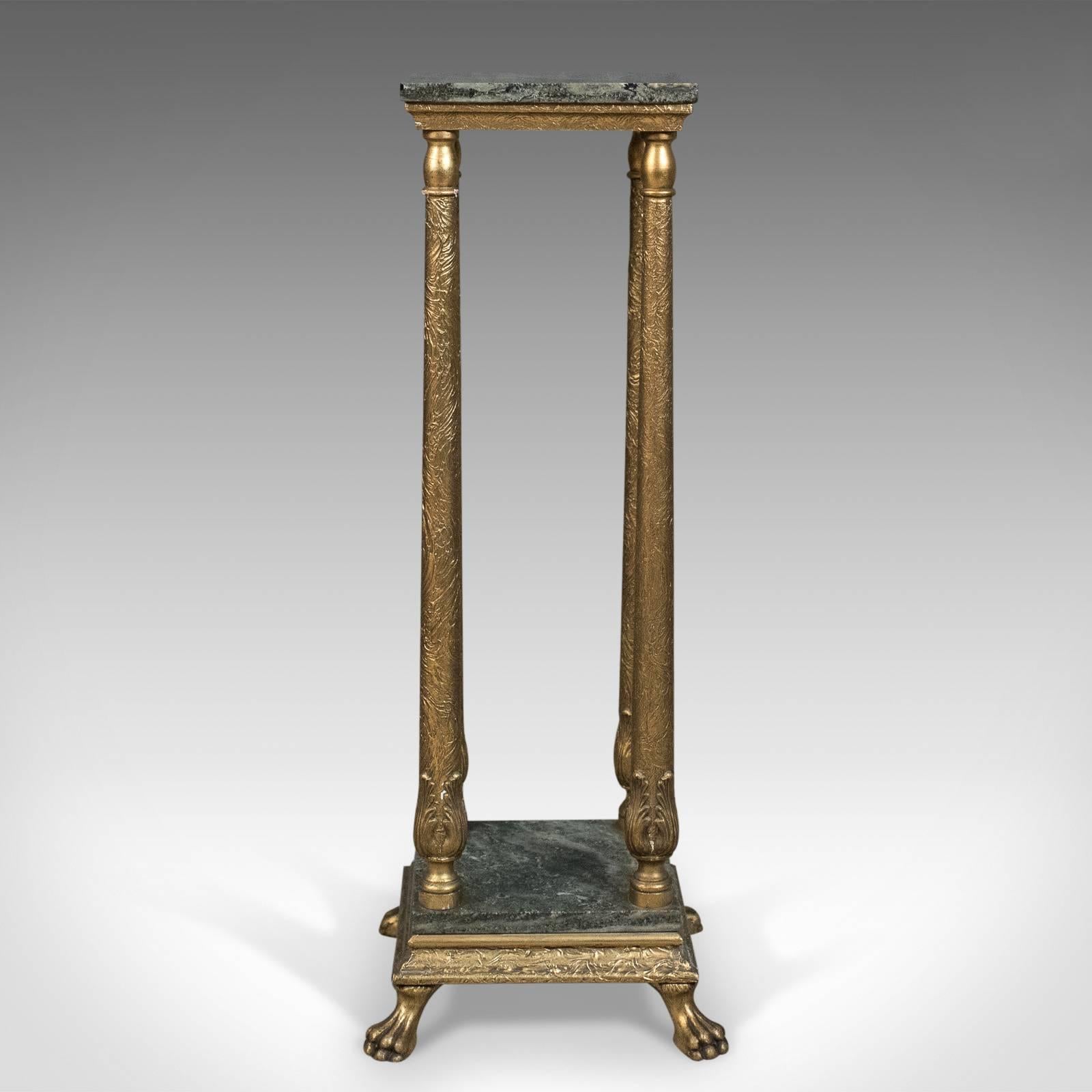 This is a French antique pedestal, a marbled plant stand with ormolu, dating to circa 1900.

Raised on lion paw feet to shaped plinth
Lower tier supporting four tapering columns
Rising from acanthus leaf mounts
Unusual textured ormolu