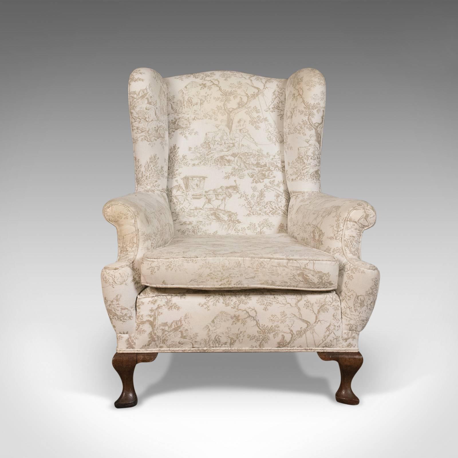 This is an antique wing back chair, an English Victorian armchair with mahogany frame dating to circa 1900.

Classic proportions offering a broad and comfortable seat
Solidly constructed with a heavy mahogany frame
Historically professionally