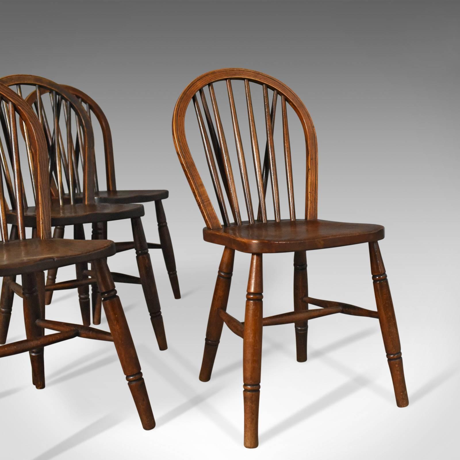 This is a set of four antique Windsor chairs from the High Wycombe area. Hoop back dining chairs with bobbin tail, circa 1880.

Beautifully crafted, country kitchen dining chairs
Good colour with desirable aged patina

Elm saddle seat panels