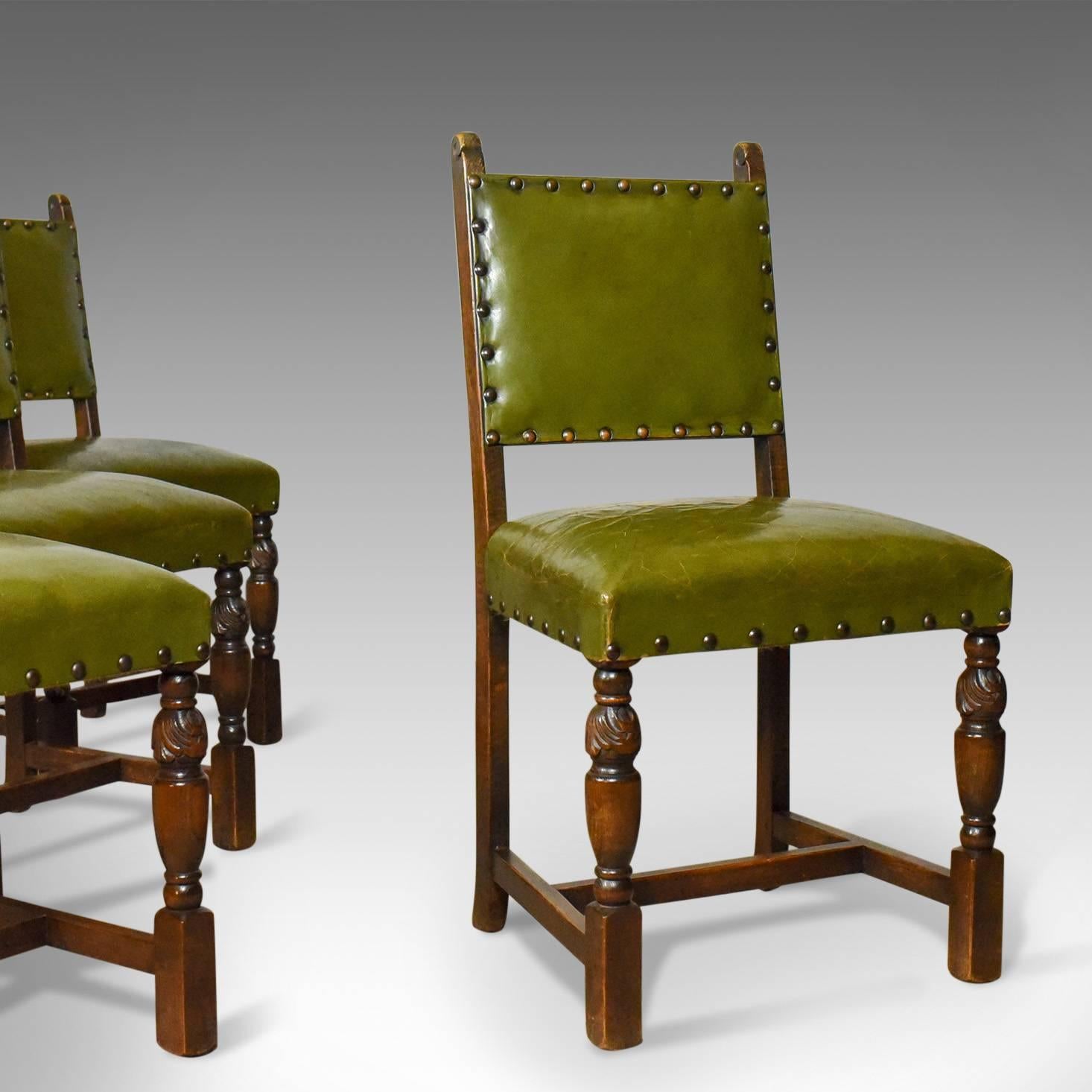 This is a set of four antique dining chairs, Jacobean revival back stools in English oak, circa 1910.

A super set of comfortable oak and leather dining chairs
The warm tones of the English oak complimented by the olive green leather
Well sprung