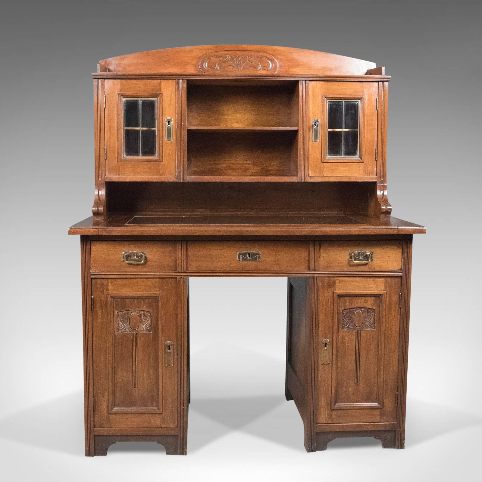 This is an antique, Art Nouveau desk, an English, Victorian, walnut cabinet, Liberty-esque in styling and dating to circa 1900.

A super piece of period Art Nouveau furniture of fine quality
Warm hues and a desirable aged patina to the walnut and