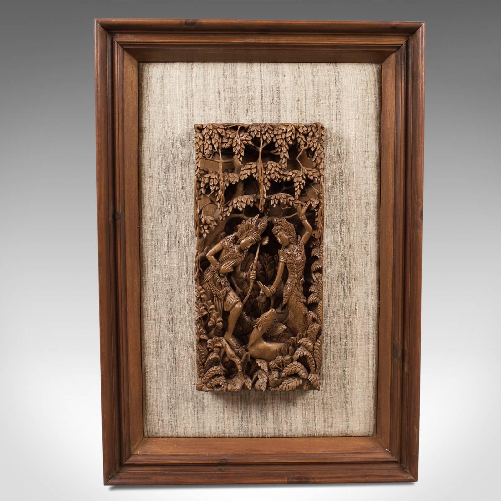This is a framed Balinese carved wall panel, a piece of midcentury decorative art.

Profusely carved demonstrating exceptional skill
Created from a single, one and a half inch thick, teak slab
Abundant interest from every angle

A woodland