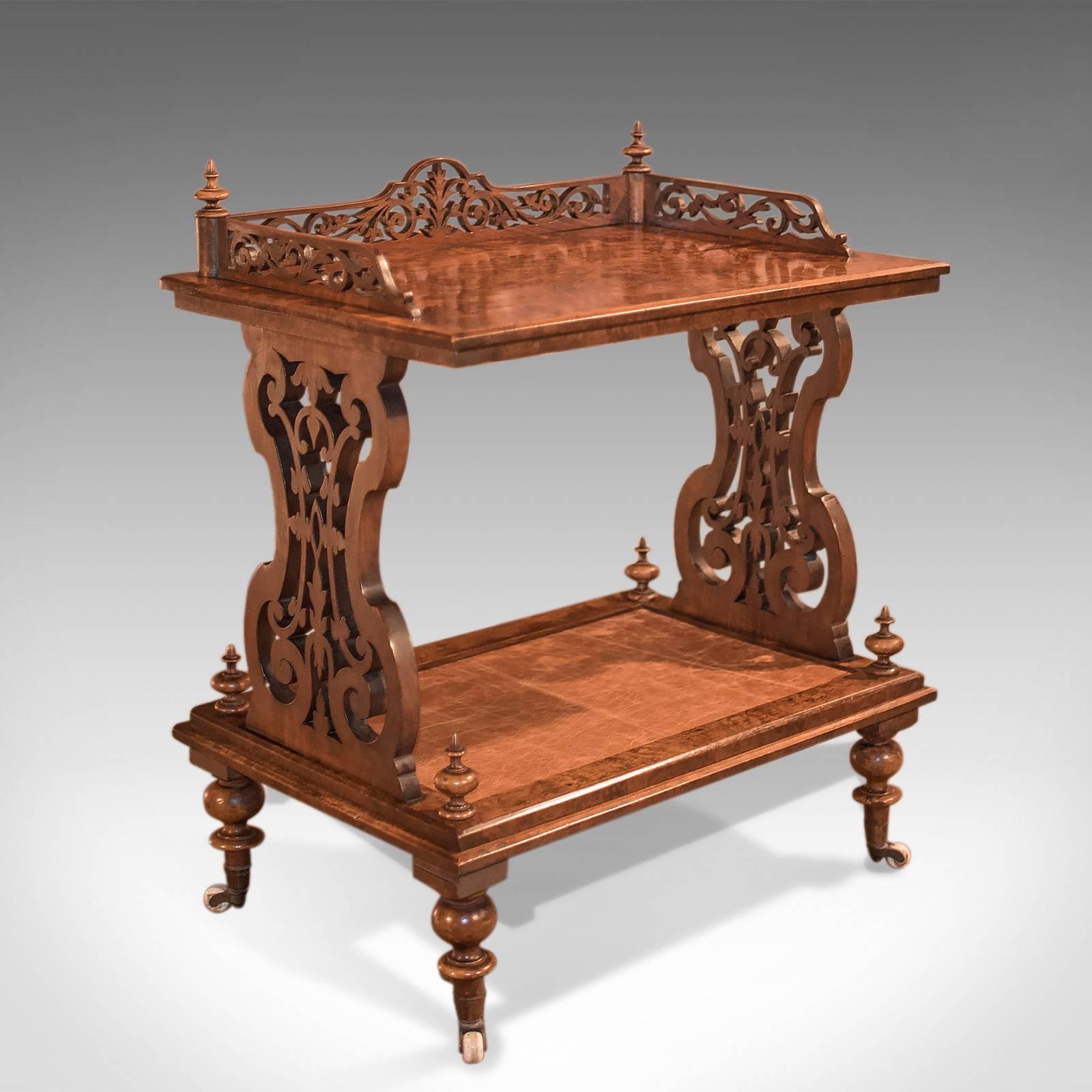 An appealing antique side table or drinks trolley, late Regency, circa 1830.

Superb quality and construction
Desirable grain detail in the butterfly matched burr walnut top
Pierced fretwork gallery featuring foliate scrolls and turned