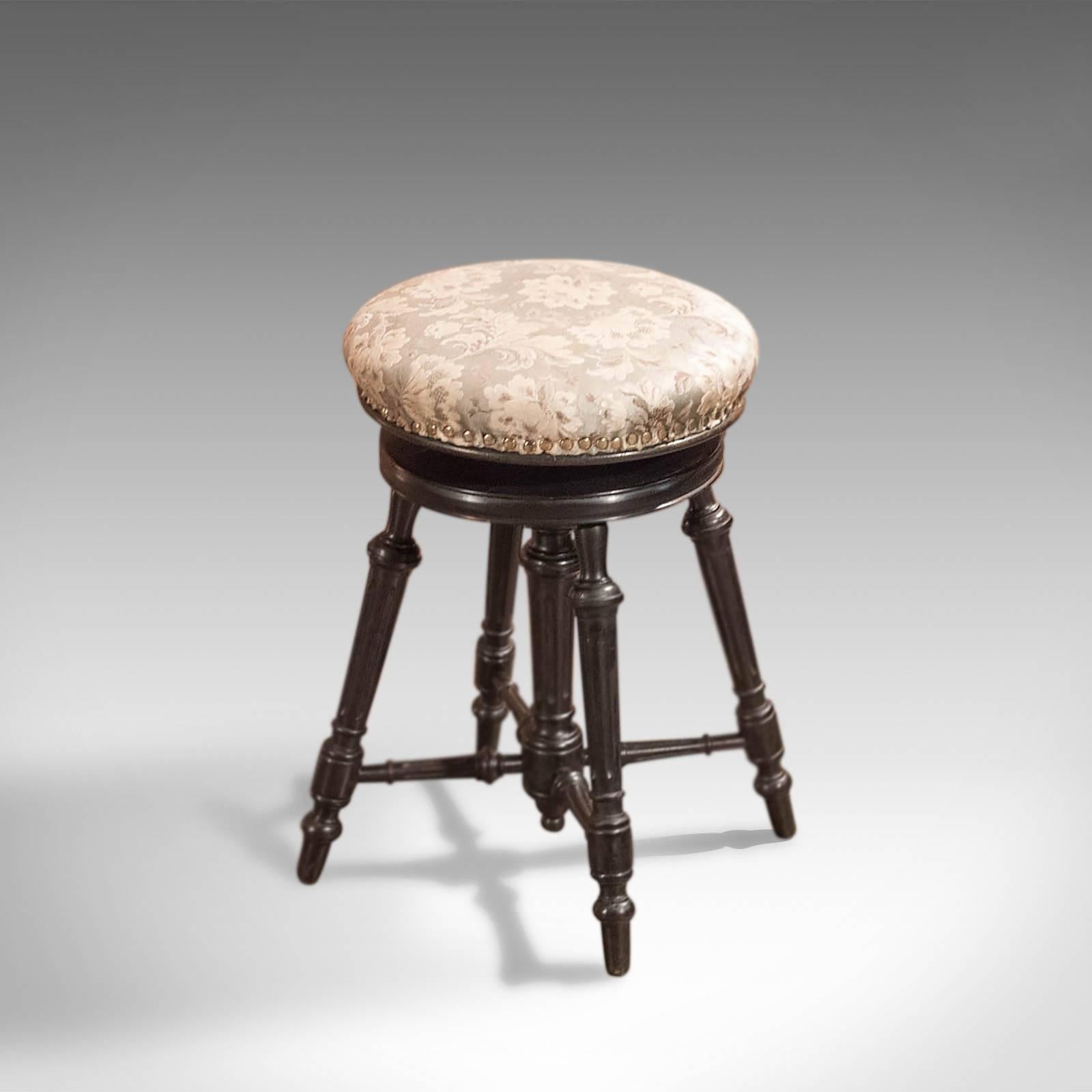 This is an adjustable height, antique piano stool dating to the 19th century, circa 1880.

Finished in an attractive dark waxed finish this stool displays Classic Aesthetic Movement over tones.

Raised on four, splayed, turned and fluted legs