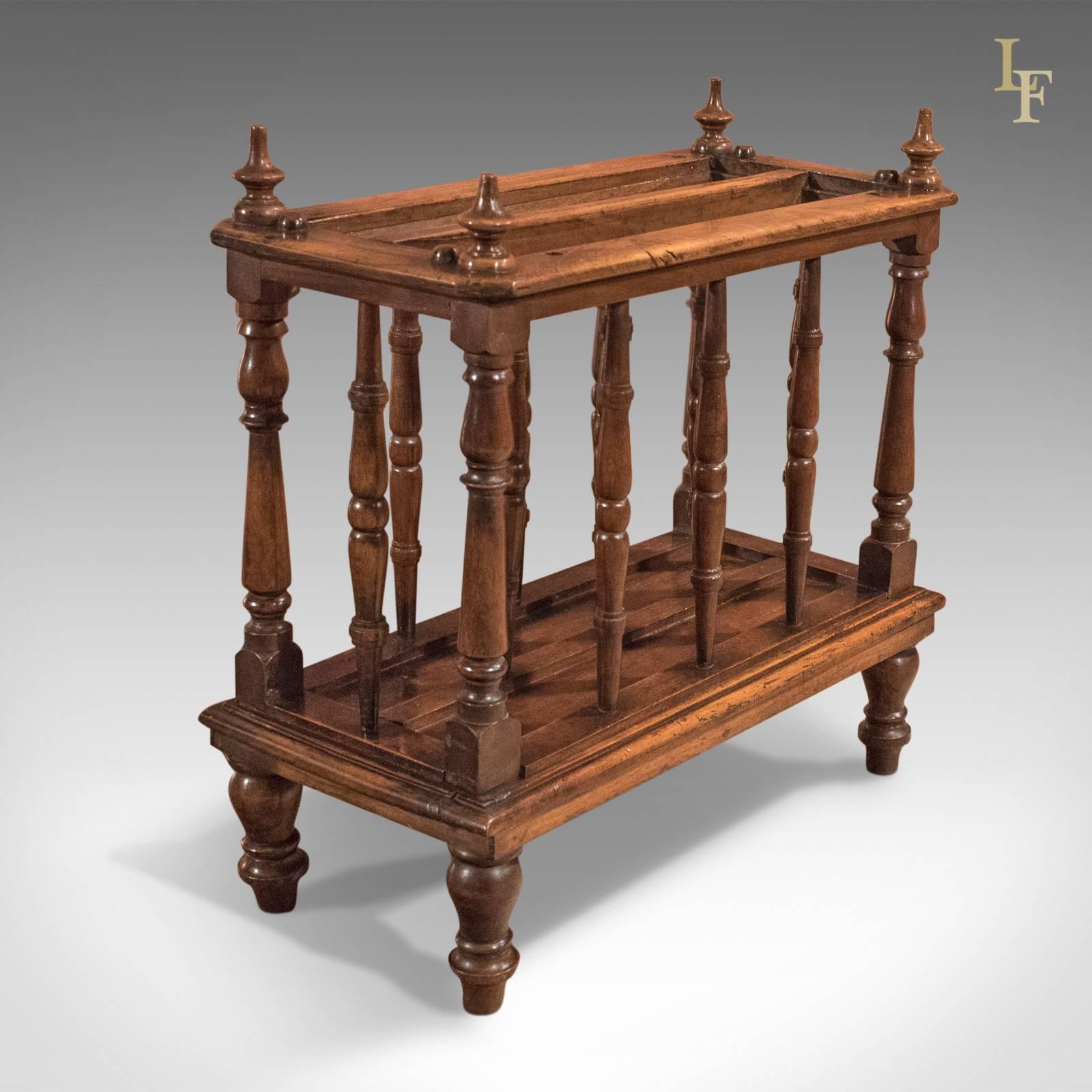 This is a super little antique Canterbury or club broadsheet rack dating to the mid-Victorian period, circa 1870.

Finished in well grained English walnut
Good colour and an aged patina
Raised on turned legs, lower platform finished with edge
