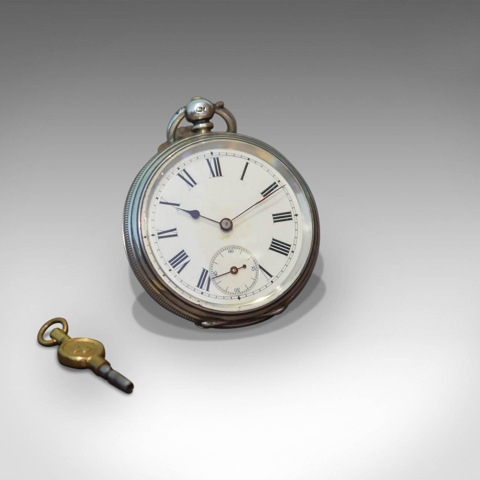 This is a good quality antique silver cased Lever pocket watch with key.

Keeping good time, this watch displays Roman numeral legend with black spade hands. A secondary seconds dial at the '6' position has Arabic legend with black hand.

The