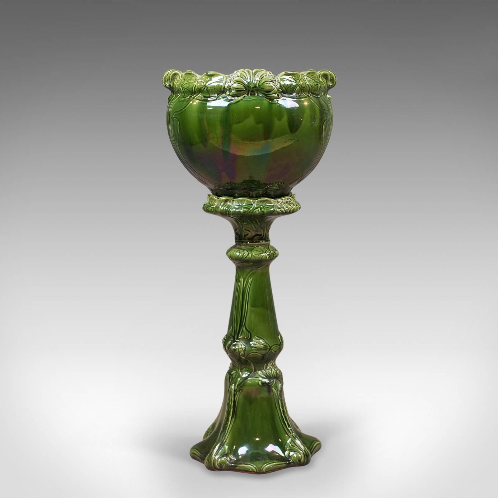 This is an appealing antique jardinière in excellent condition dating to the late Victorian period, circa 1880.

Beautifully presented pottery in hues of natural green
The stand and pot rim featuring foliate decoration
Large pot to accommodate a