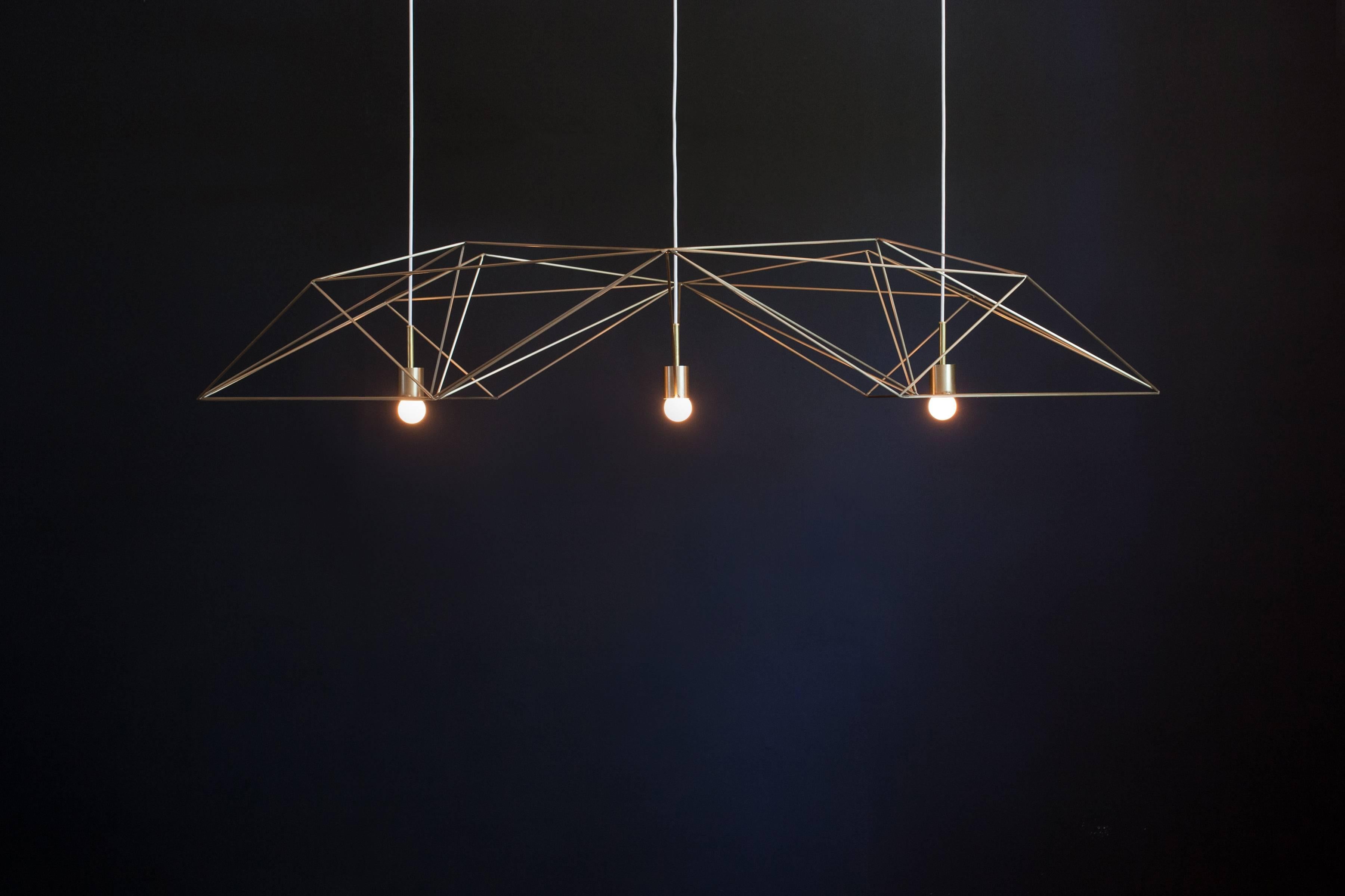 The ‘Crystalline Light’ is a statement chandelier, light in form yet strong in presence. Inspired from mineralogy, this piece – crafted from thin steel rods – gives form and movement to complex patterns depending on your viewpoint. It’s geometric