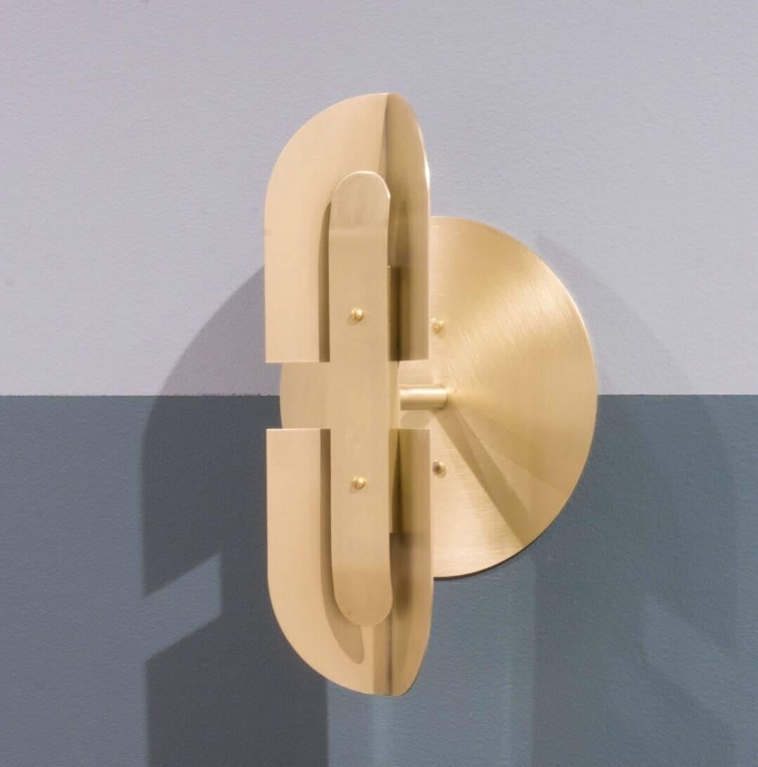 Fold is an elegant hardwired LED powered sconce in a satin brass finish. 

Available in black patina and satin nickel finishes. Also sold in pairs, please see other listings.

This listing is for the satin brass finish with large diameter (7