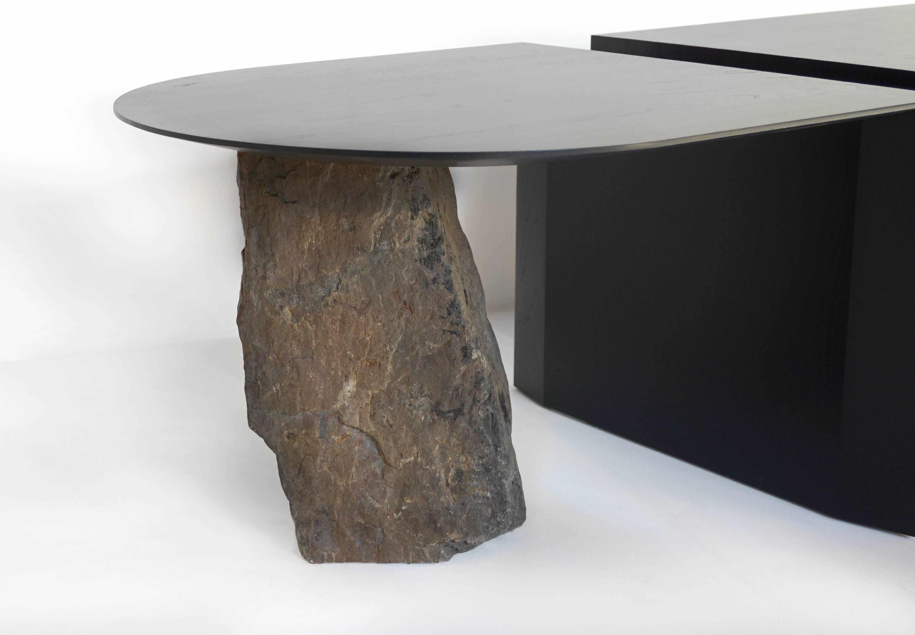 Missisquoi 01 is a numbered and asymmetrical two part coffee or cocktail table, with a space that divides it as the river divides the Missisquoi Valley. The black ashwood was felled, milled and dried near the studio, and the stone is from the