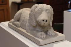 Carved Marble Figure of a Reclining Dog