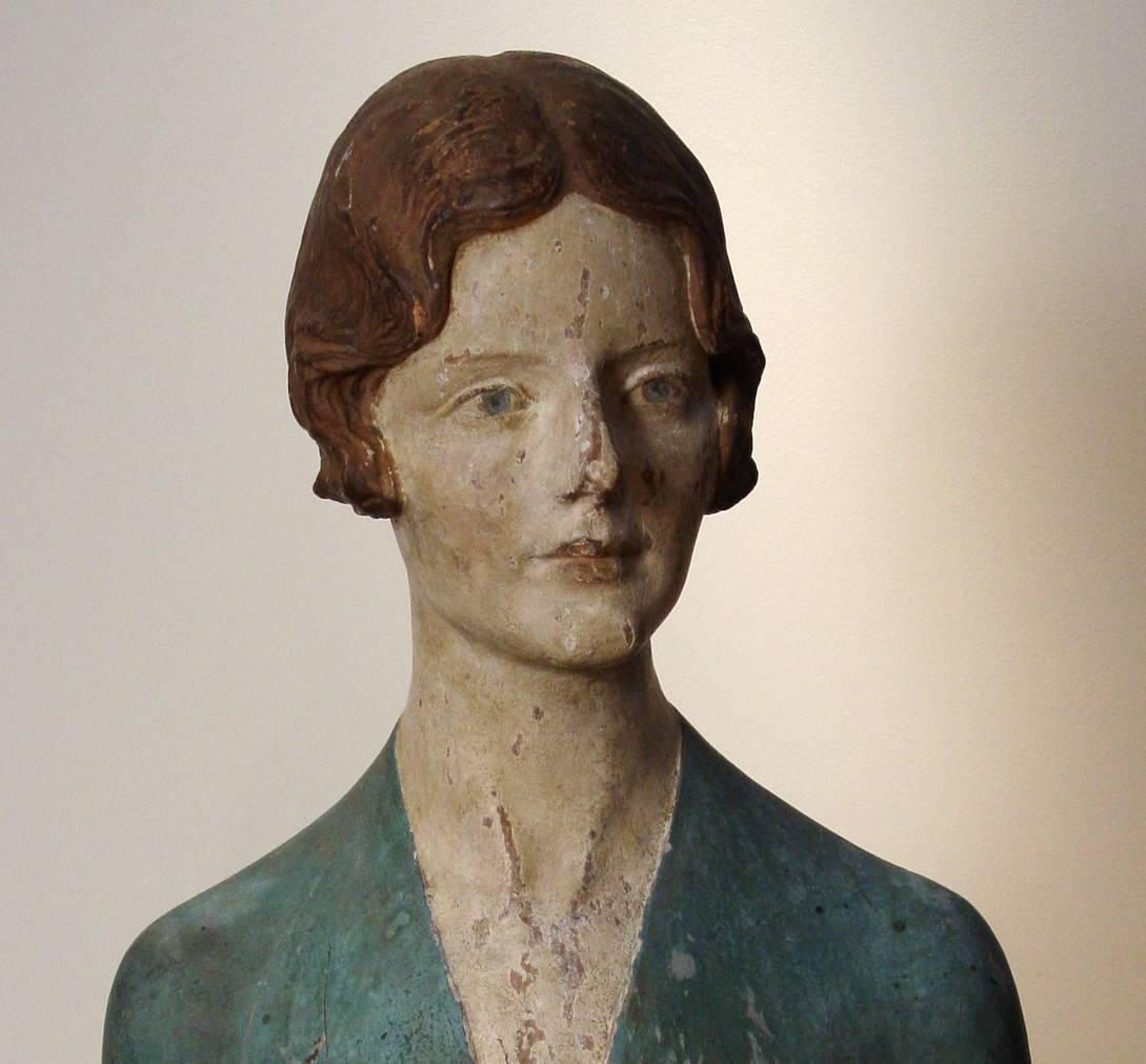 A carved and polychrome decorated portrait bust of a lady on a carved and gilded oak base. The subject may be the artist's wife, the modern dancer Hilda Beyer. 

Incised signature 'MARIO KORBEL' to lower left of reverse. Mario Korbel (1882-1954)