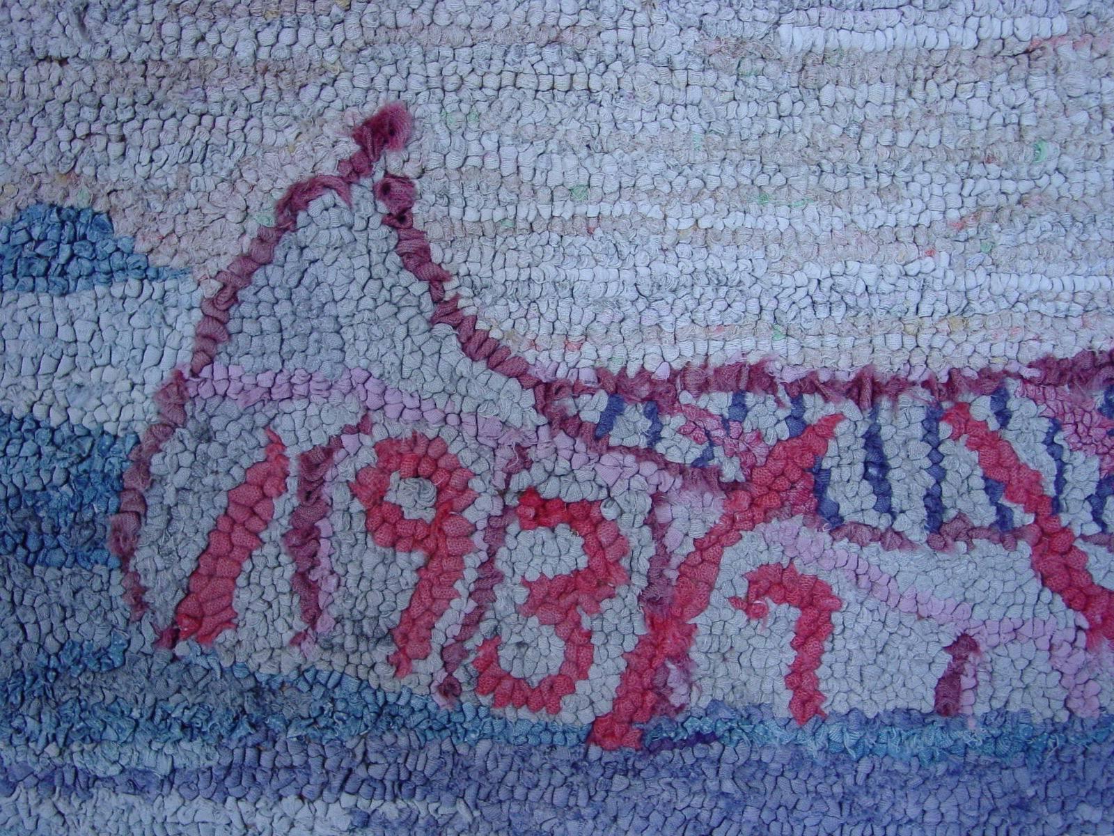 This cheerful and lively hooked rug reflects the peaceful simplicity of rural life, with a blooming garden, blue-curtained red house, doves nesting, barn and ford parked in the drive. The author of this piece placed the date, 