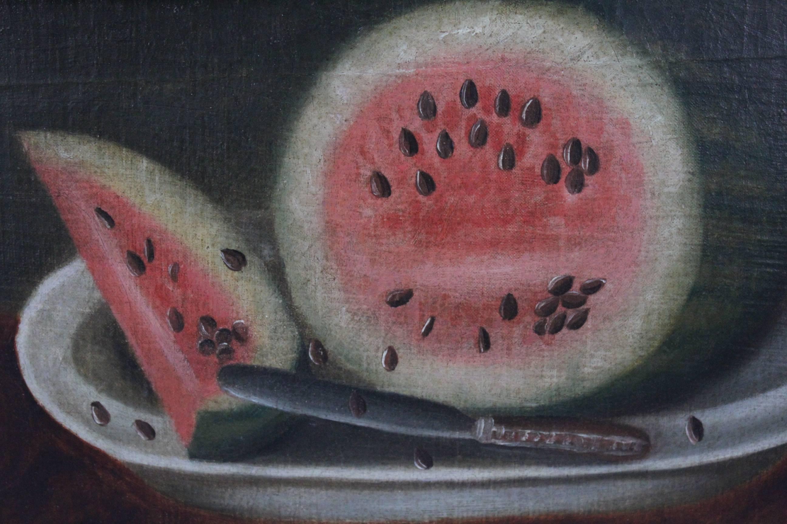 A charming oil on canvas Folk Art painting still life depicting a cat and dog below a table topped with sliced watermelon. In a period, perhaps original, black-painted frame. Cleaned, lined and mounted on a new stretcher with scattered