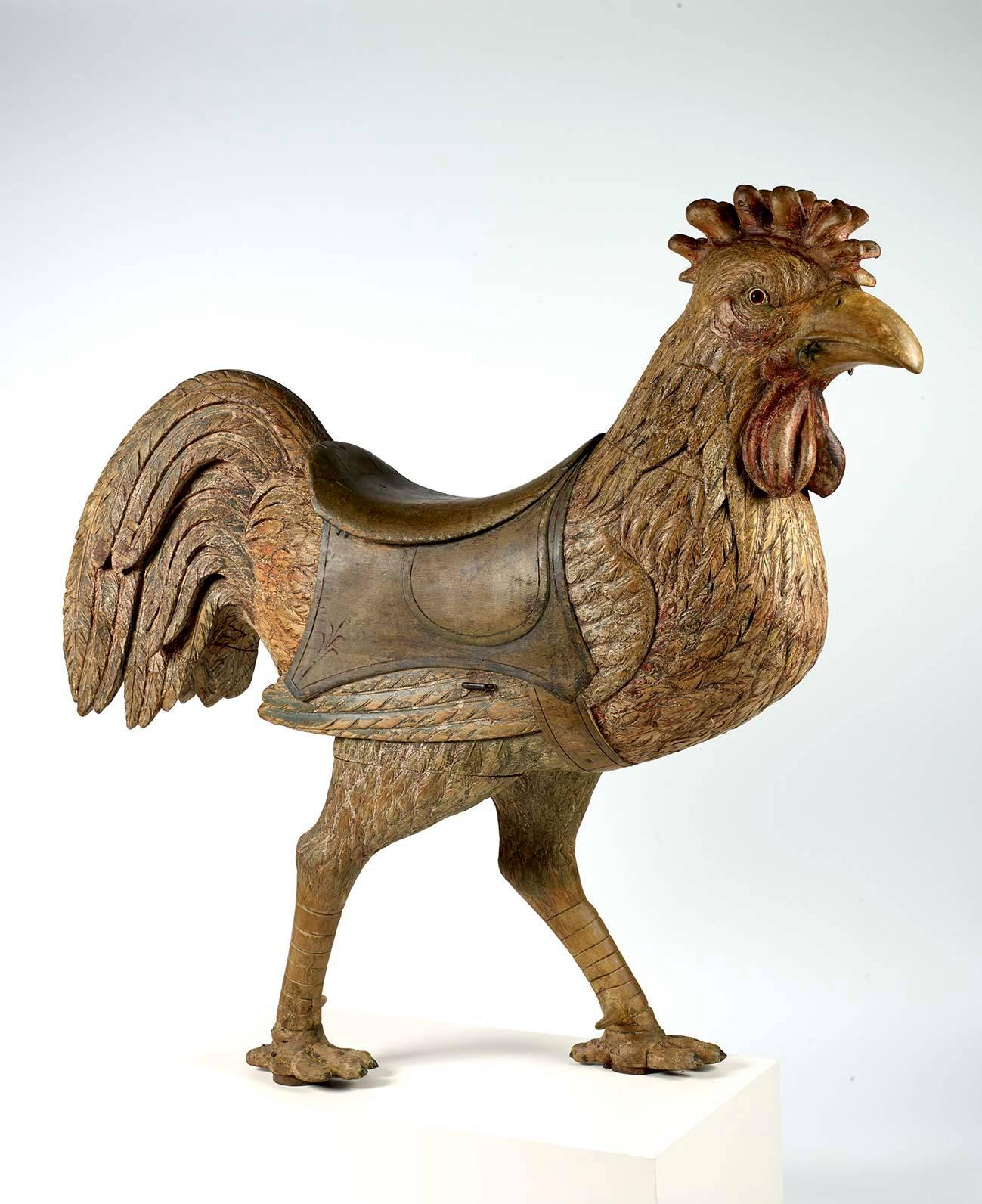 A rare polychrome-decorated and carved basswood carousel rooster figure by the Dentzel Company of Philadelphia. There are approximately six large Dentzel carousel roosters known to exist. This one surfaced locally in the 1970s and at this time we do