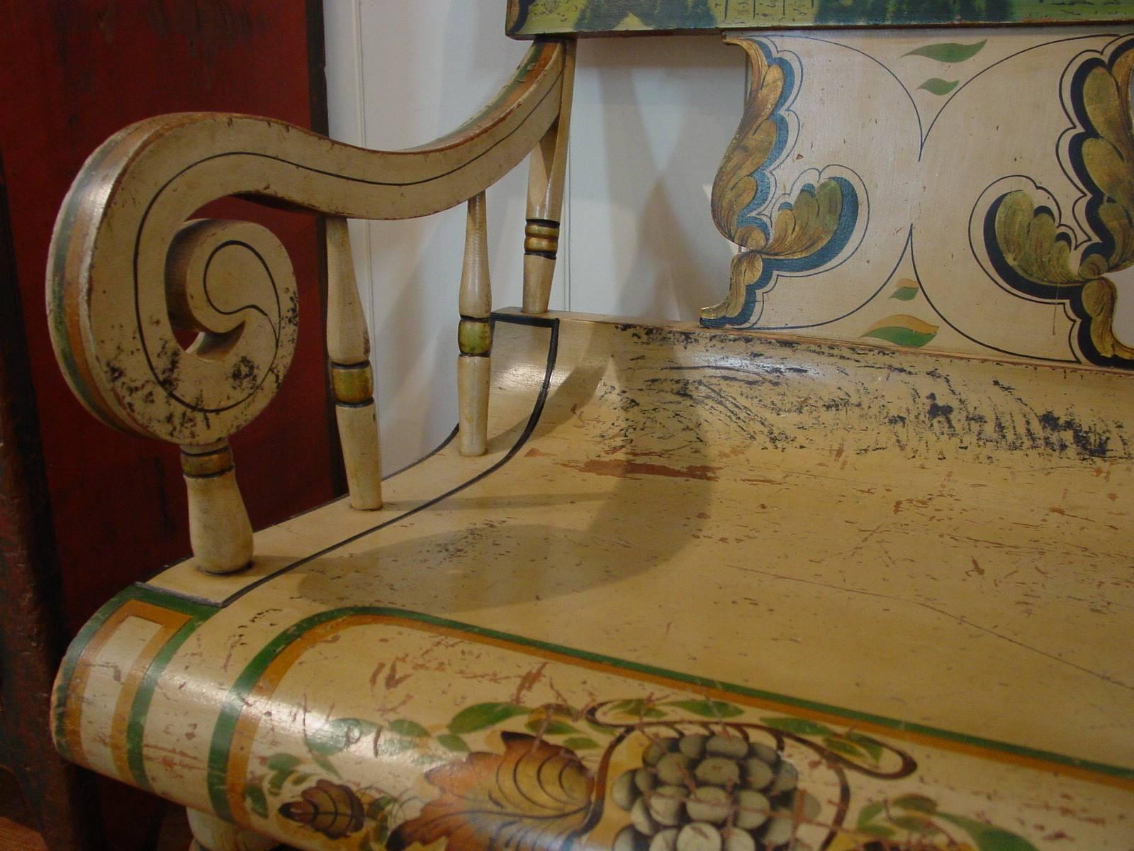 Attributed to William F. Snyder, Mifflintown chairworks, Juniata County, Pennsylvania, this settee features extraordinary stenciled and free-hand paint decoration on a cream ground. 

Of the few known Pennsylvania windsor settees with landscape