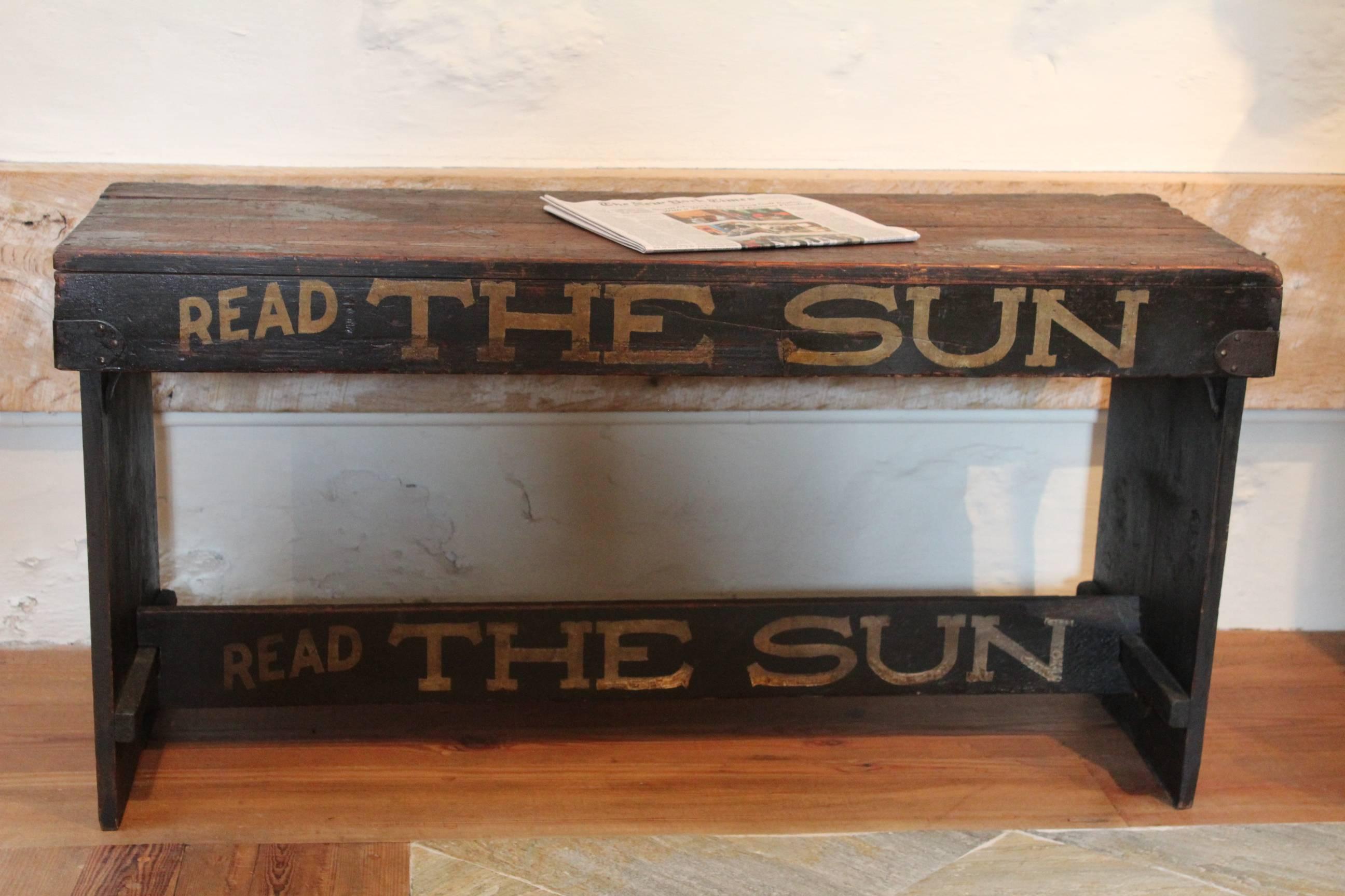 News bench
“Read The Sun” (1833-1950)
New York City, circa 1900
Pine and iron with the original painted finish. Inscribed on front, back & ends “Read The Sun” in white lettering on a black painted ground.
Measures: Height 24”, W. 48”, D. 17 ¾” -