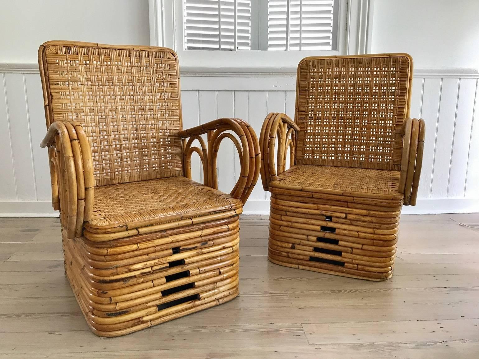Mid-Century American rattan suite with large scrolling arms and caned seats and backs; measurements below are for the chairs; settee measures 64.5
