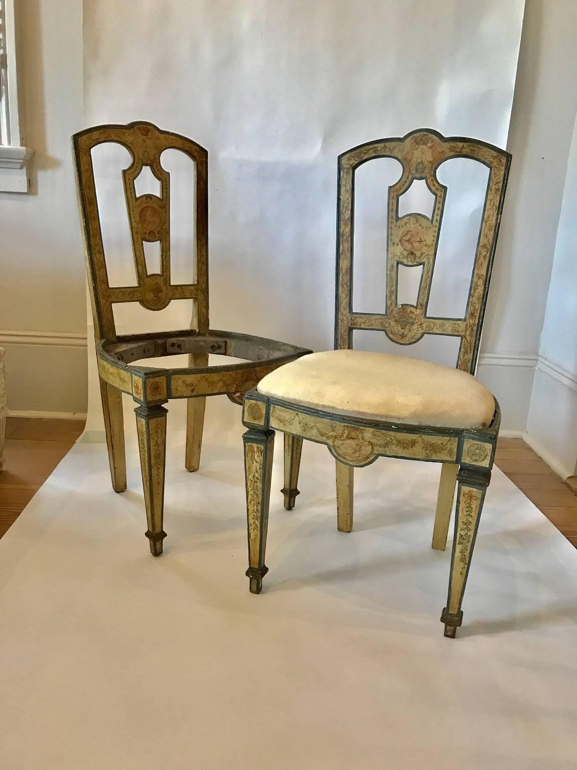 Four 18th century Italian side chairs with exceptional painted decoration; highly detailed garlands, rosettes, and flower baskets abound; cartouches with classical figures decorate the backsplats; slip-seats (only one photographed in place) appear