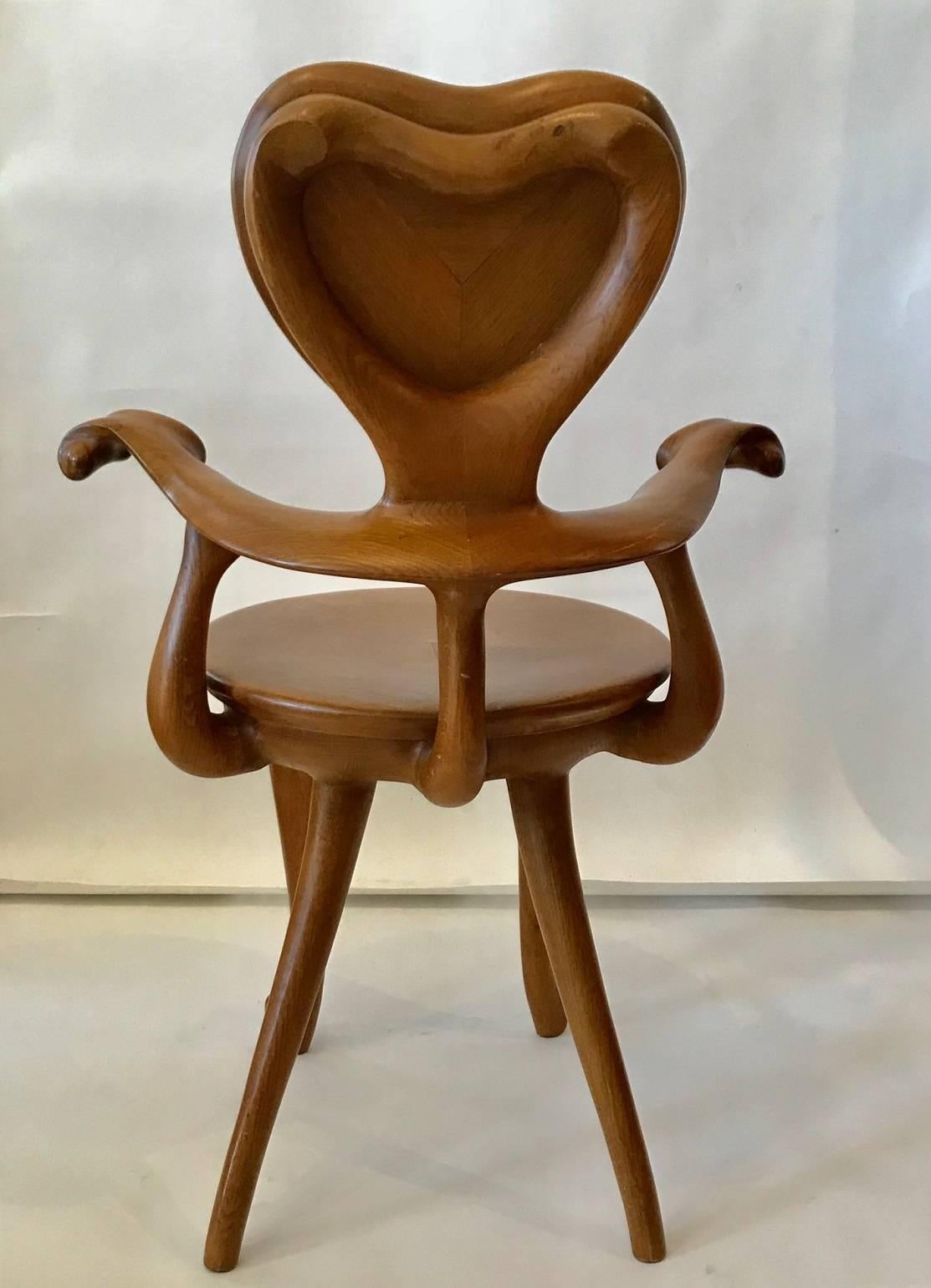 Iconic Calvet armchair by Antoni Gaudi, designed 1902 for Gaudi's Casa Calvet; manufactured by BDBarcelona, circa 1990; the sculptural form realized in solid varnish oak.