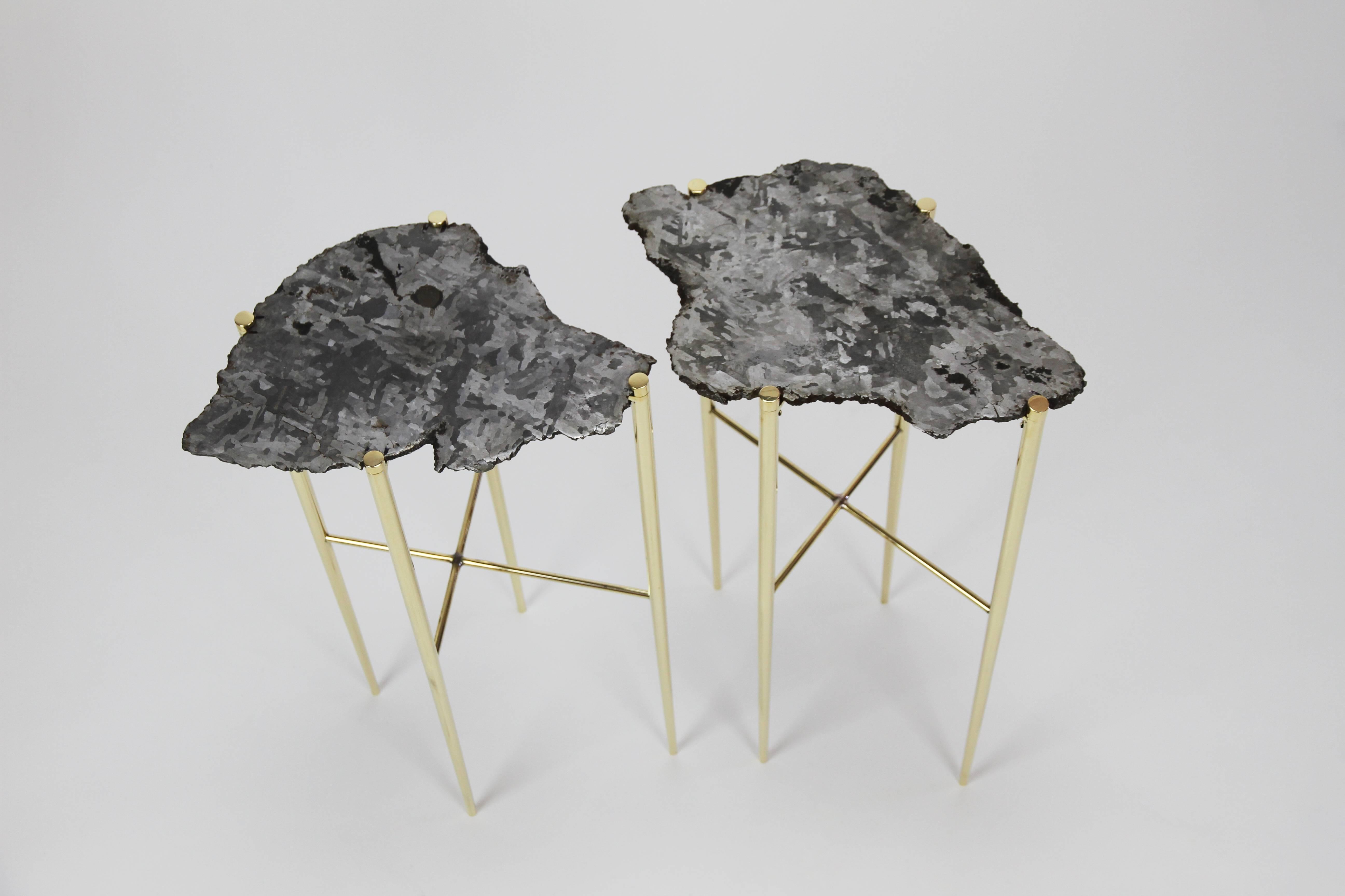 The Meteorite Cocktail tables are jewelry for the home.    
Selected etched cross sections of a 5,000-year-old Meteorite, found in Argentina, are placed upon handcrafted solid brass bases.
The legs are individually turned, tapered, high polished and