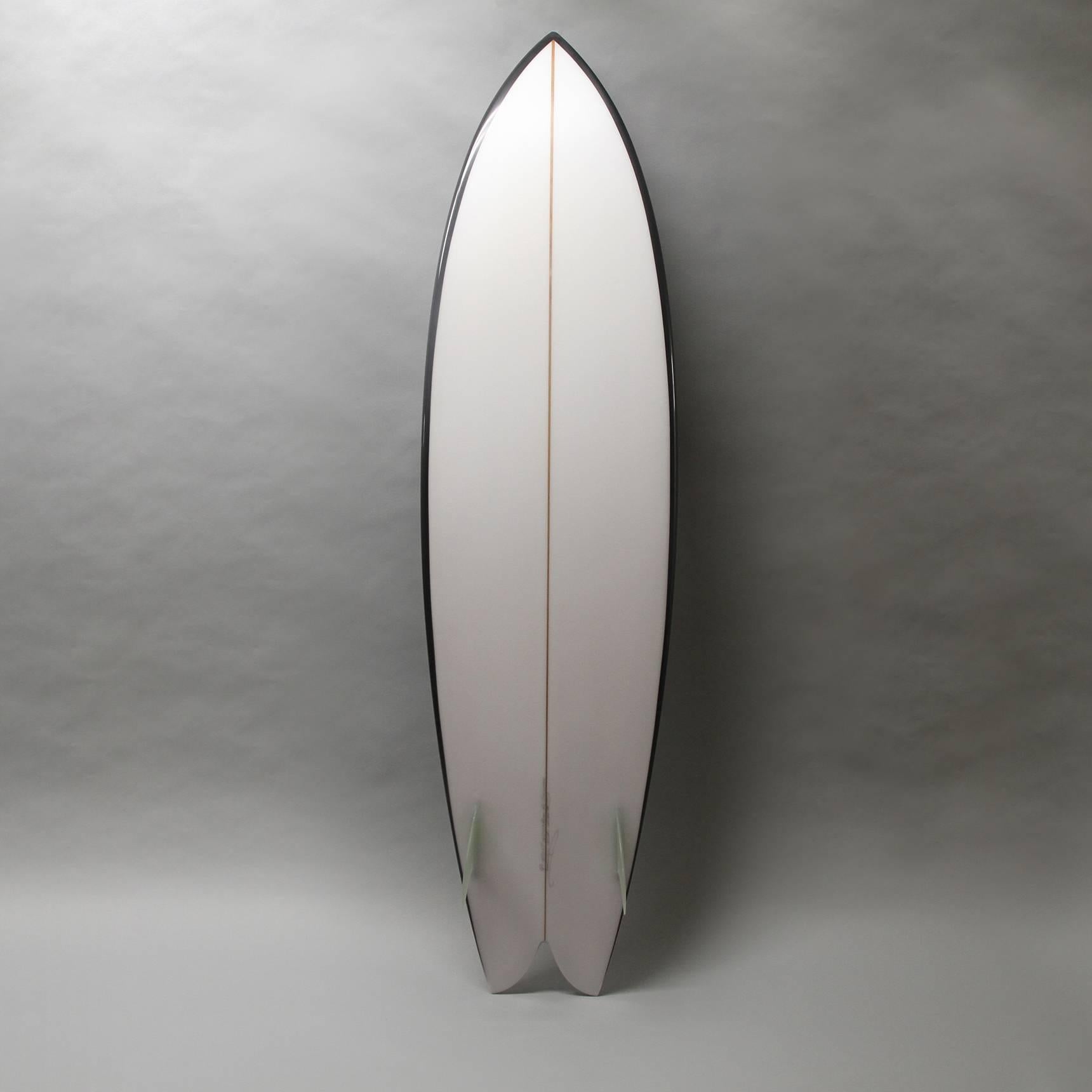 This custom board was inspired by Ellsworth Kelly's Dazzle war ships and will add a bit of socal to any room. It is an actual board designed with Chris Christensen and can be used for surfing, yet I see it as a sculpture to team against a wall or