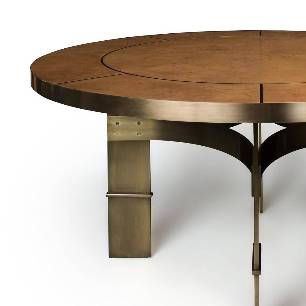Corso dining table 

Measures: D 60” x H 30”
Shown in burnished brass and rose gold parchment

 