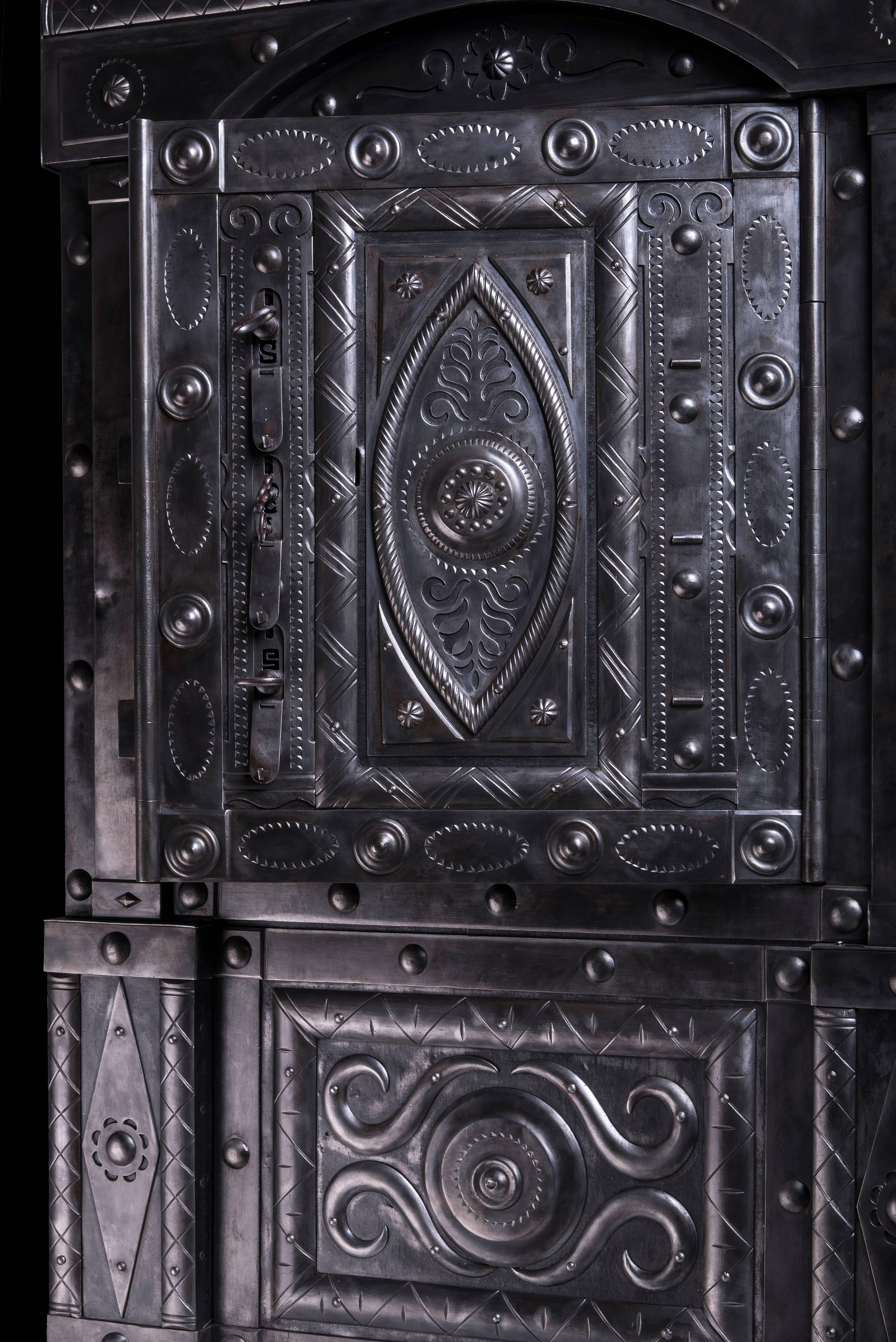 Crafted around the first half of 19th century by Northern Italian master blacksmith, this safe is a true and unique piece of art. The safe features amazingly rich and various decorations, emphazized by the two side columns and the typical hobnails.