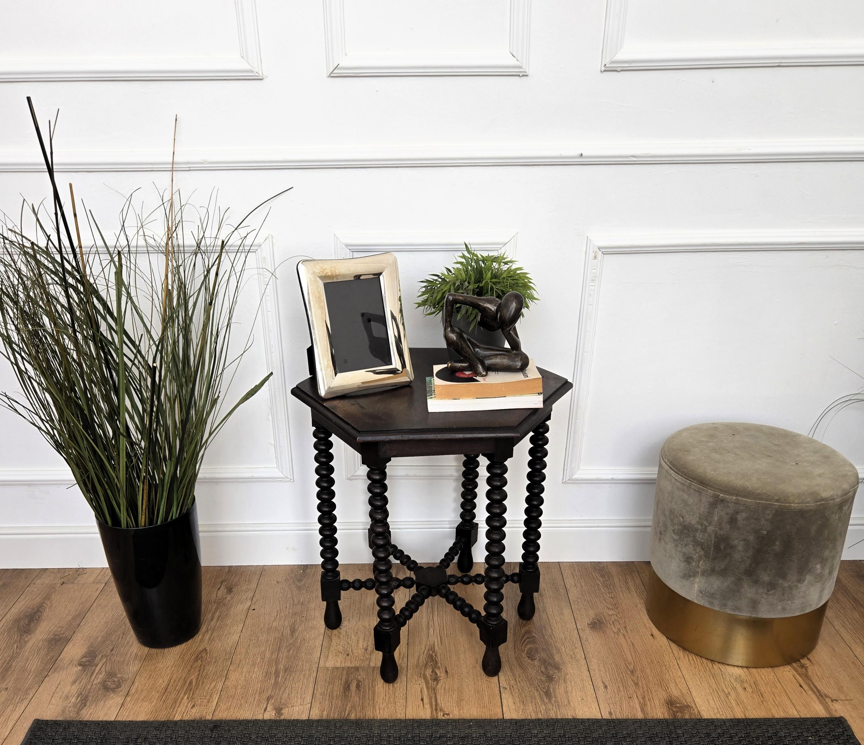 Beautiful antique Italian solid walnut side table, features hexagonal top with beveled edges over six beautifully bobbin turned legs, connected to one another with star shaped central stretcher. 
This Italian walnut side table or coffee table with