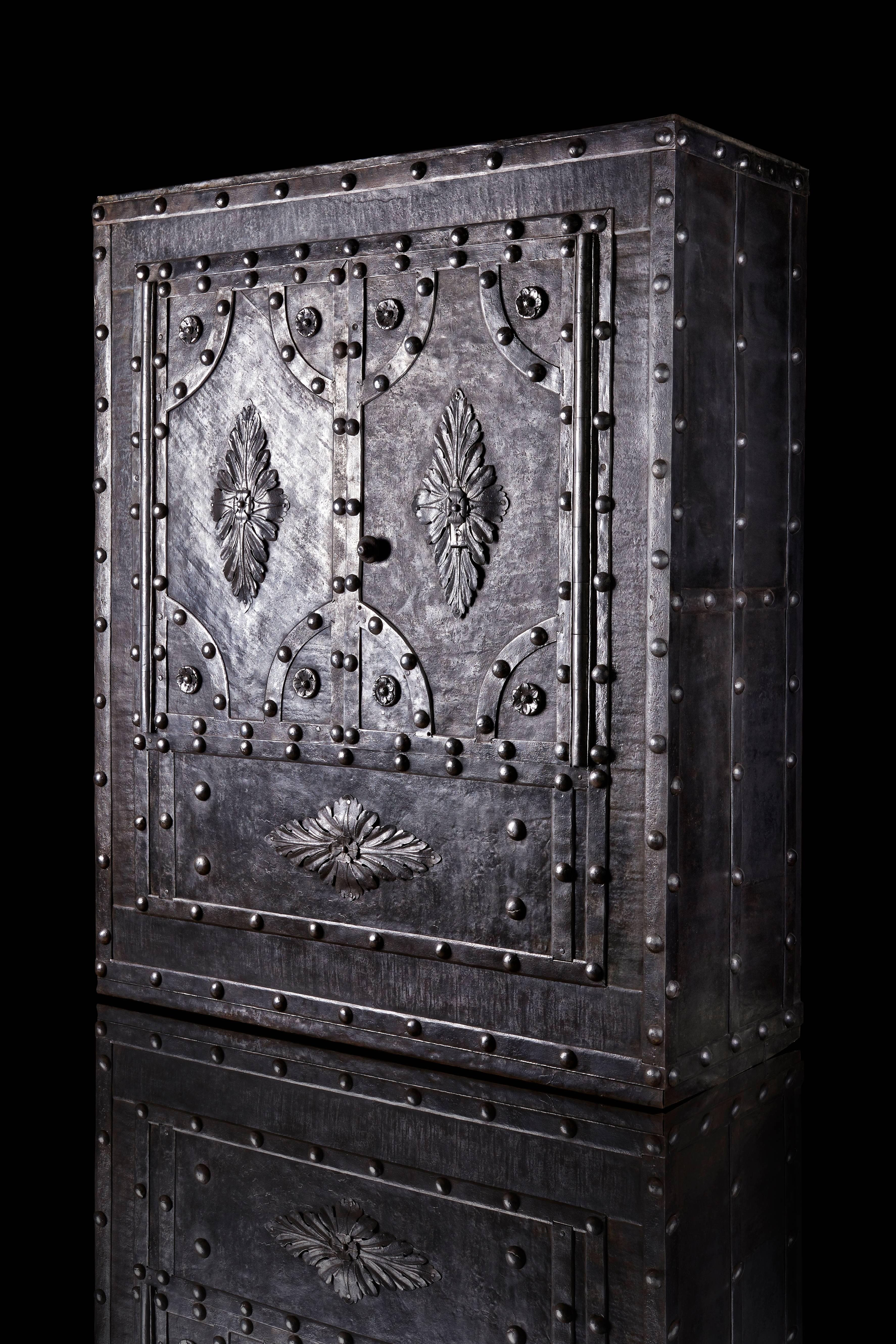 Crafted in Milan in 1824 by master blacksmith Mr. Giuseppe Bettiga as signed on the internal of the right door, this very rare double leaf door safe has beautiful decorations that hide incredible locks and opening secret combination that works with