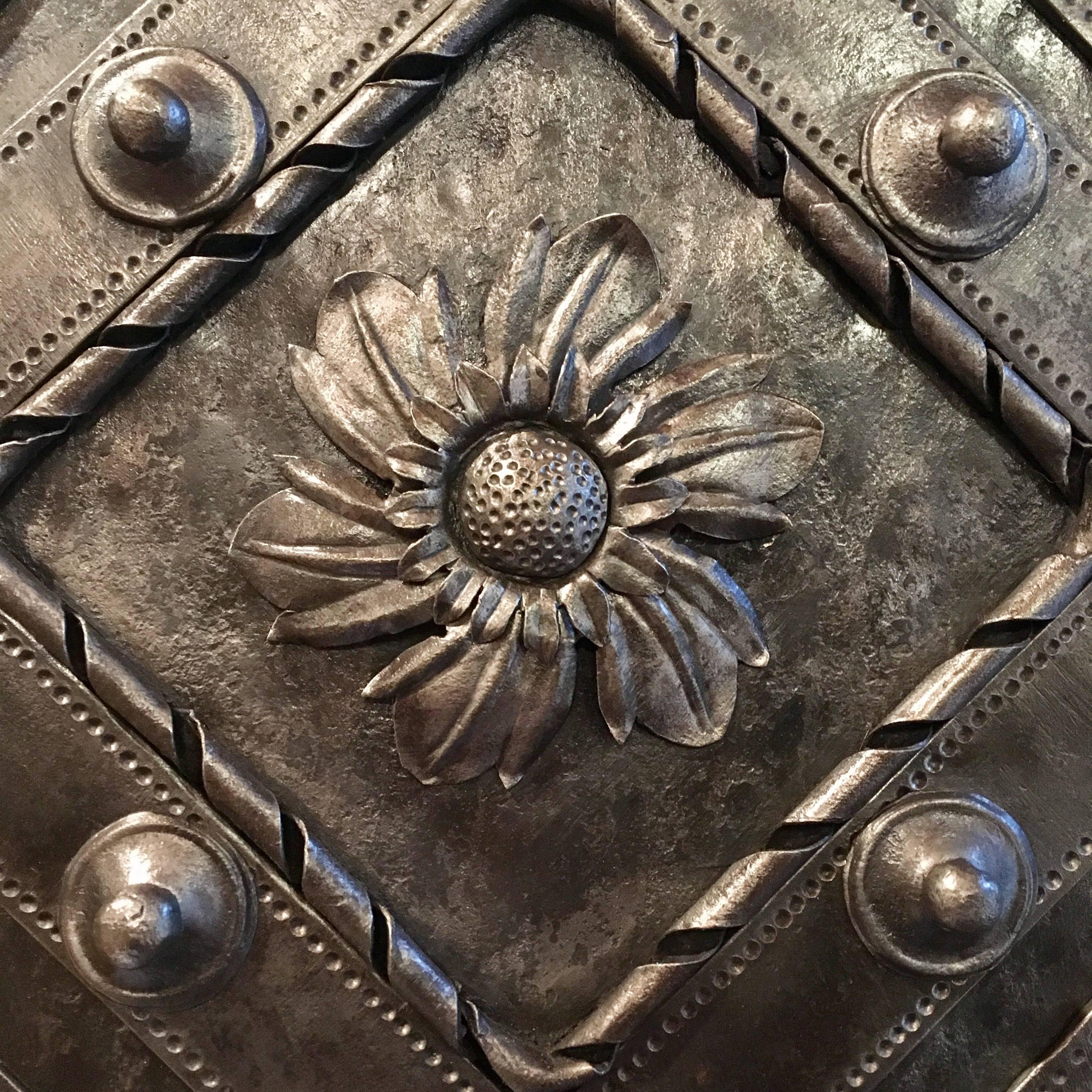 Northern Italian, specifically from the Piedmont region area, medium size hobnail safe, dated circa 1790-1830. Every part of the safe shows detailed and great decorations with a central flower that dominates the front door. 

The perfectly working