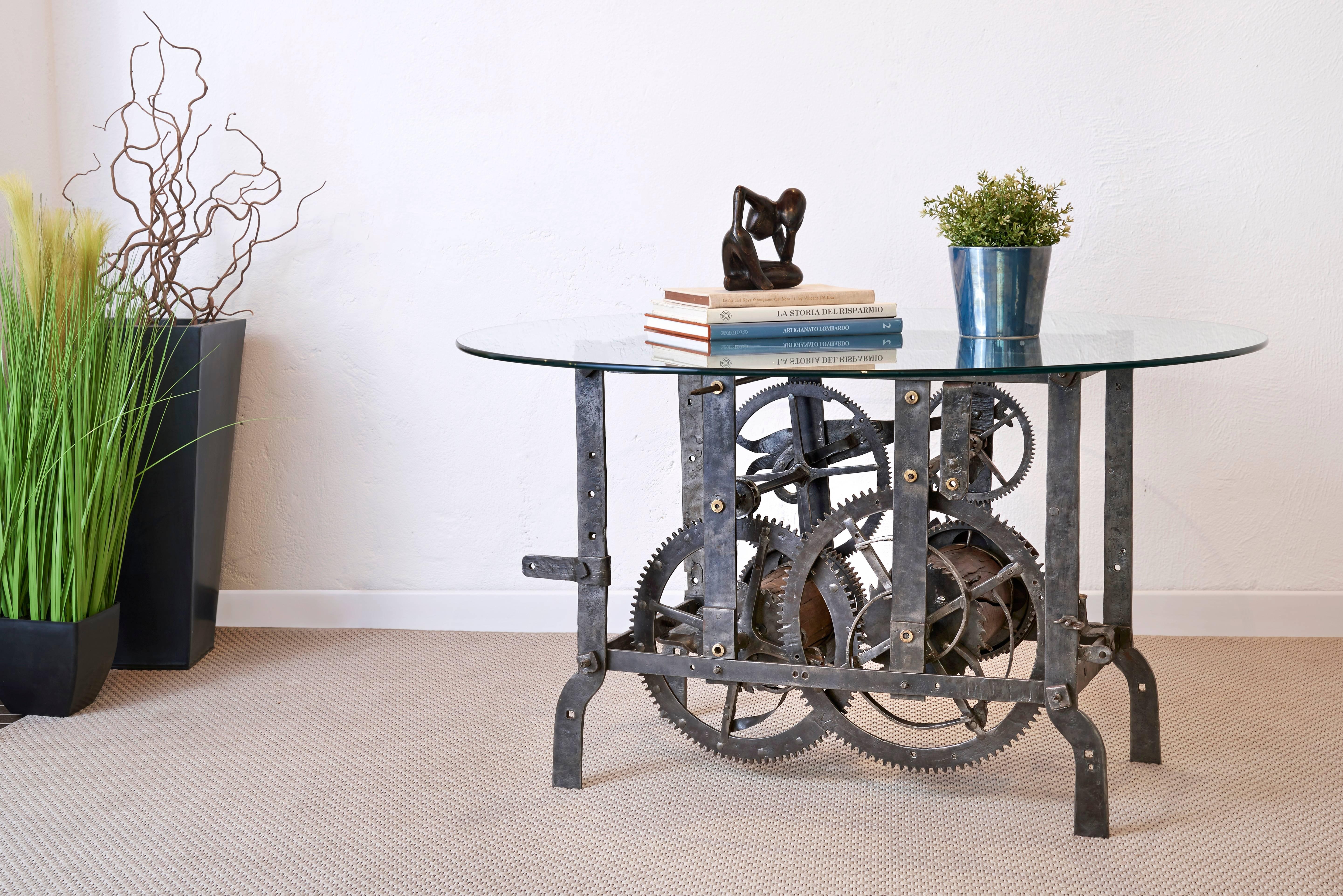 Beautiful coffee table designed from an authentic 18th century Italian tower turret clock mechanism. This mechanism was used for large clocks and bells you find up churches and public towers to keep time for the community. The mechanism is in forged