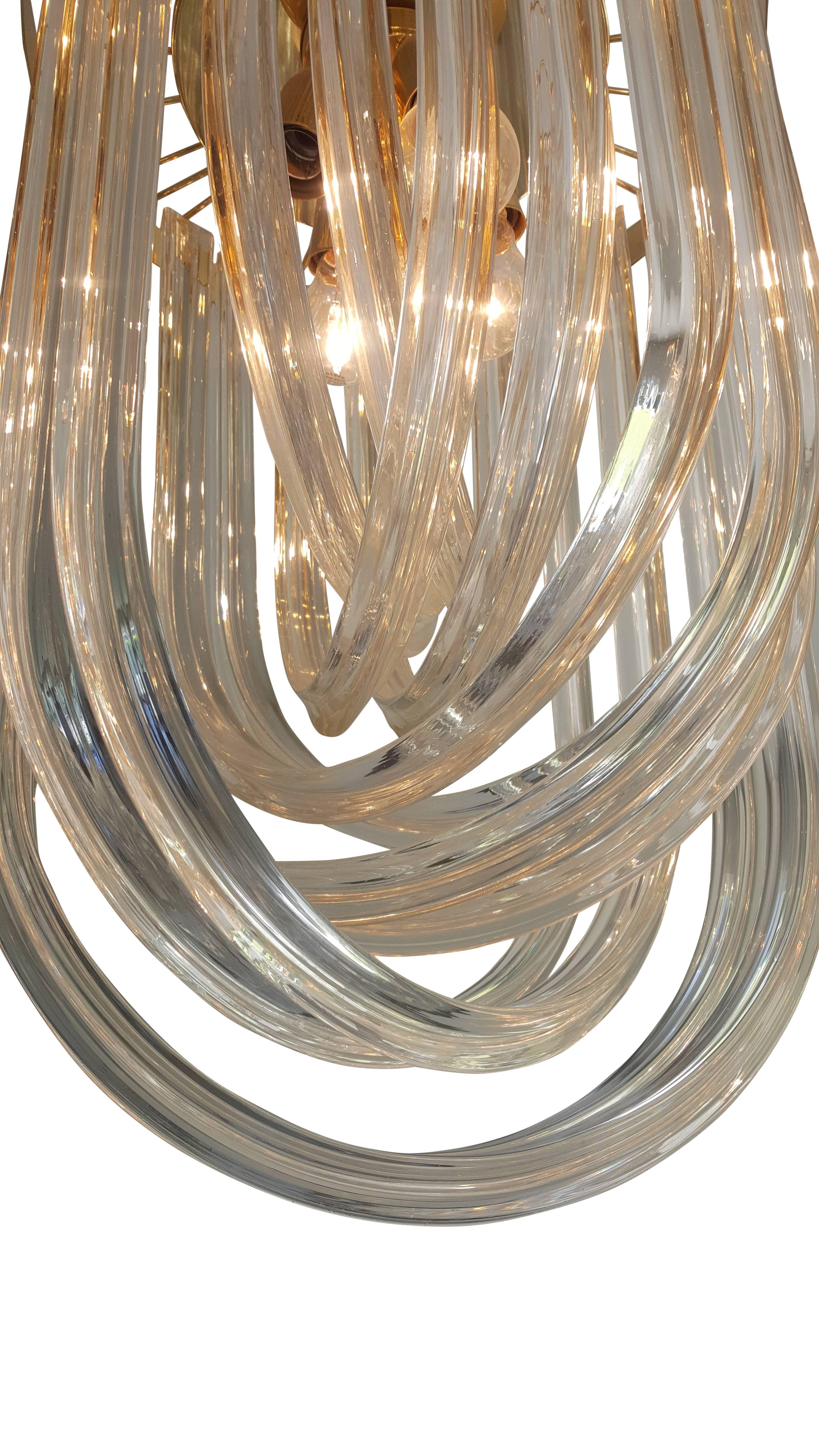 Murano chandelier 
The Murano features a series of long sculptural drops which let reflected light sparkle from the internal light fittings. The chandelier has a circular frame.
 