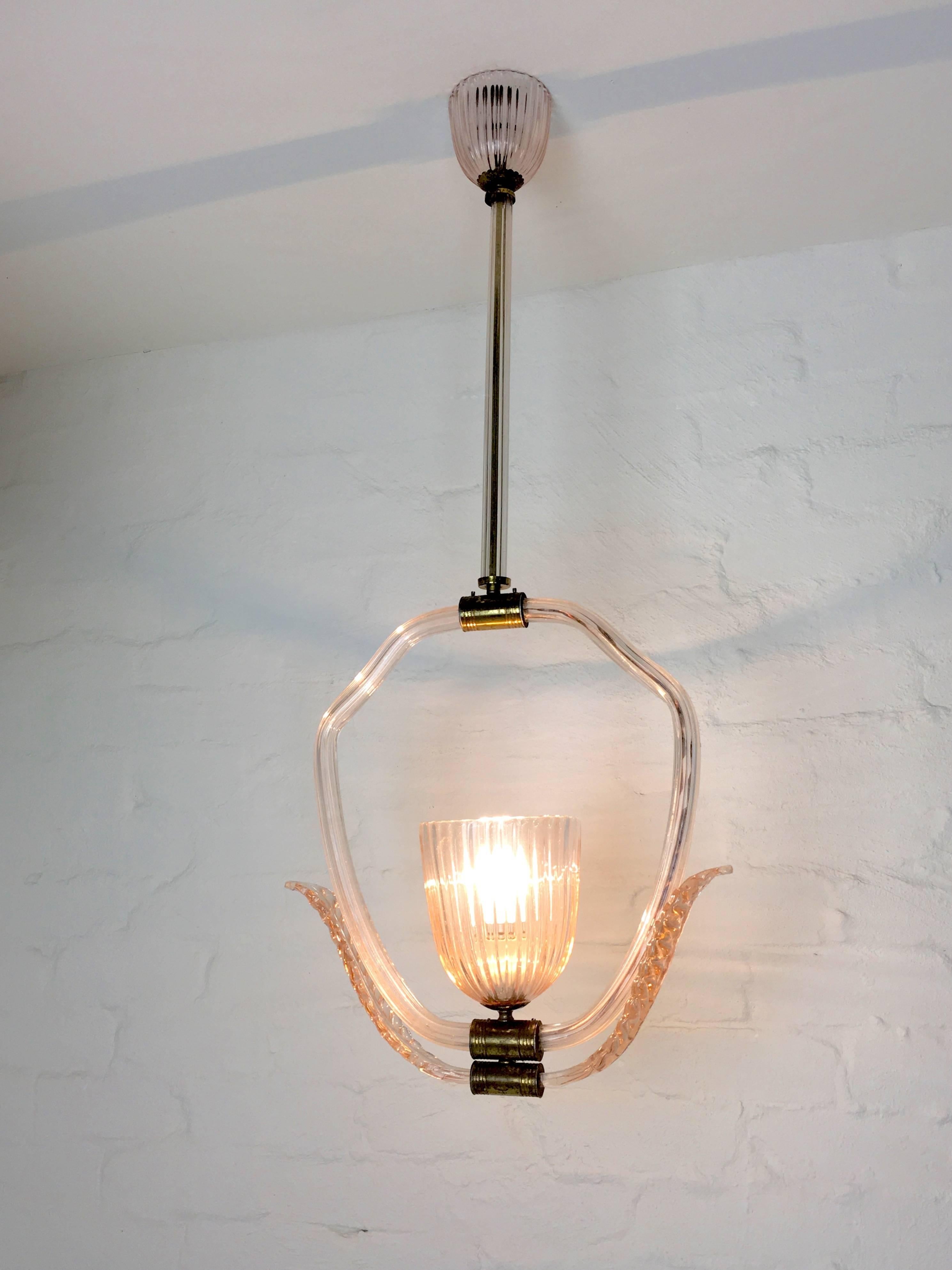 This lovely light came from the hallway of a late 1930s Melbourne bayside mansion. In Rose Pink Murano glass with brass fittings, it takes a single B22 (standard bayonet) bulb.

Beautiful oxide patina on the brass. Not as fragile as its delicate