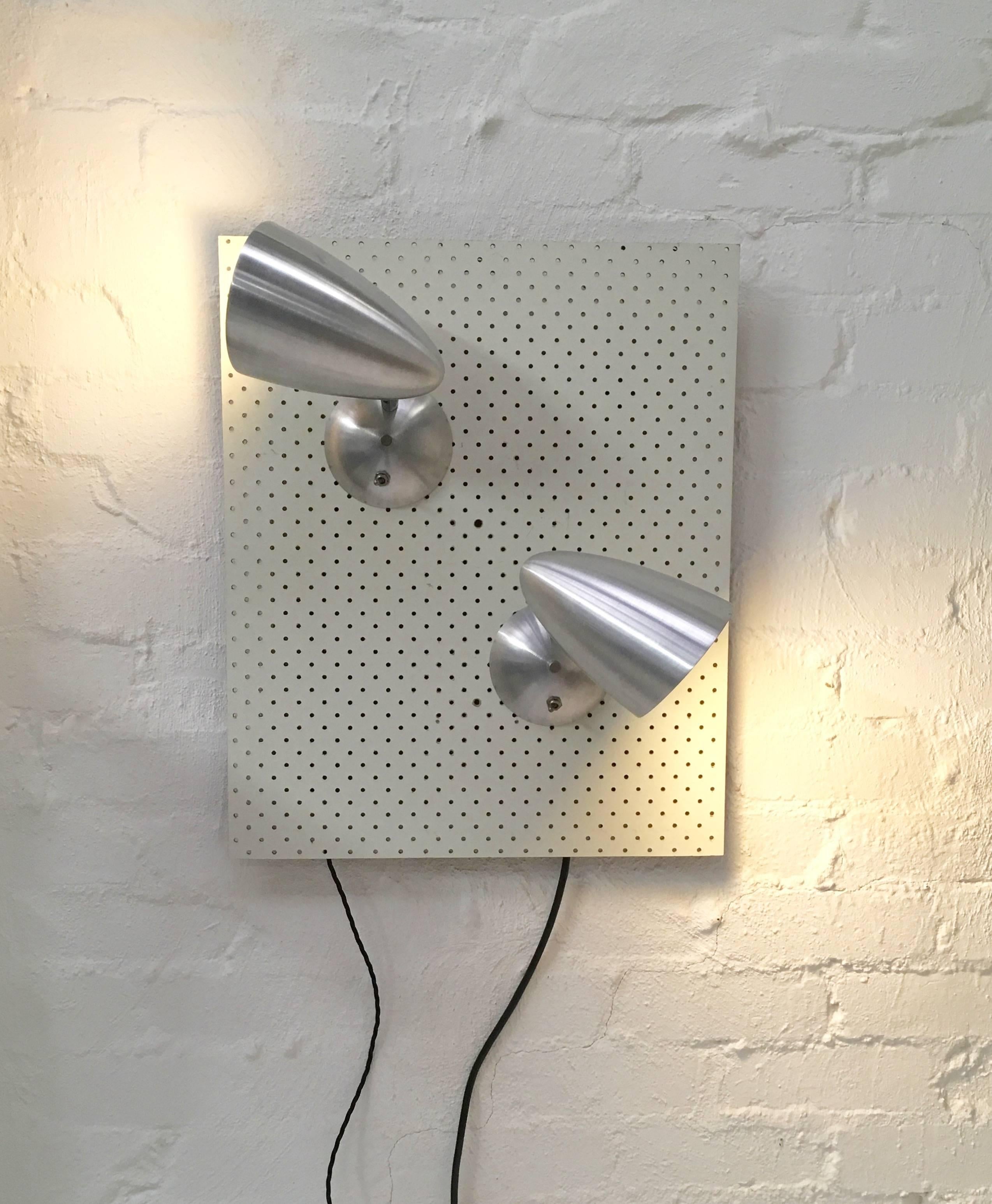A wonderful pair of wall lights produced by Australia's foremost designer of architectural lighting in the 1950s and 60s, Donald Brown of BECO Lighting. They are in superb condition, fully restored and rewired. 

Australian collectors and
