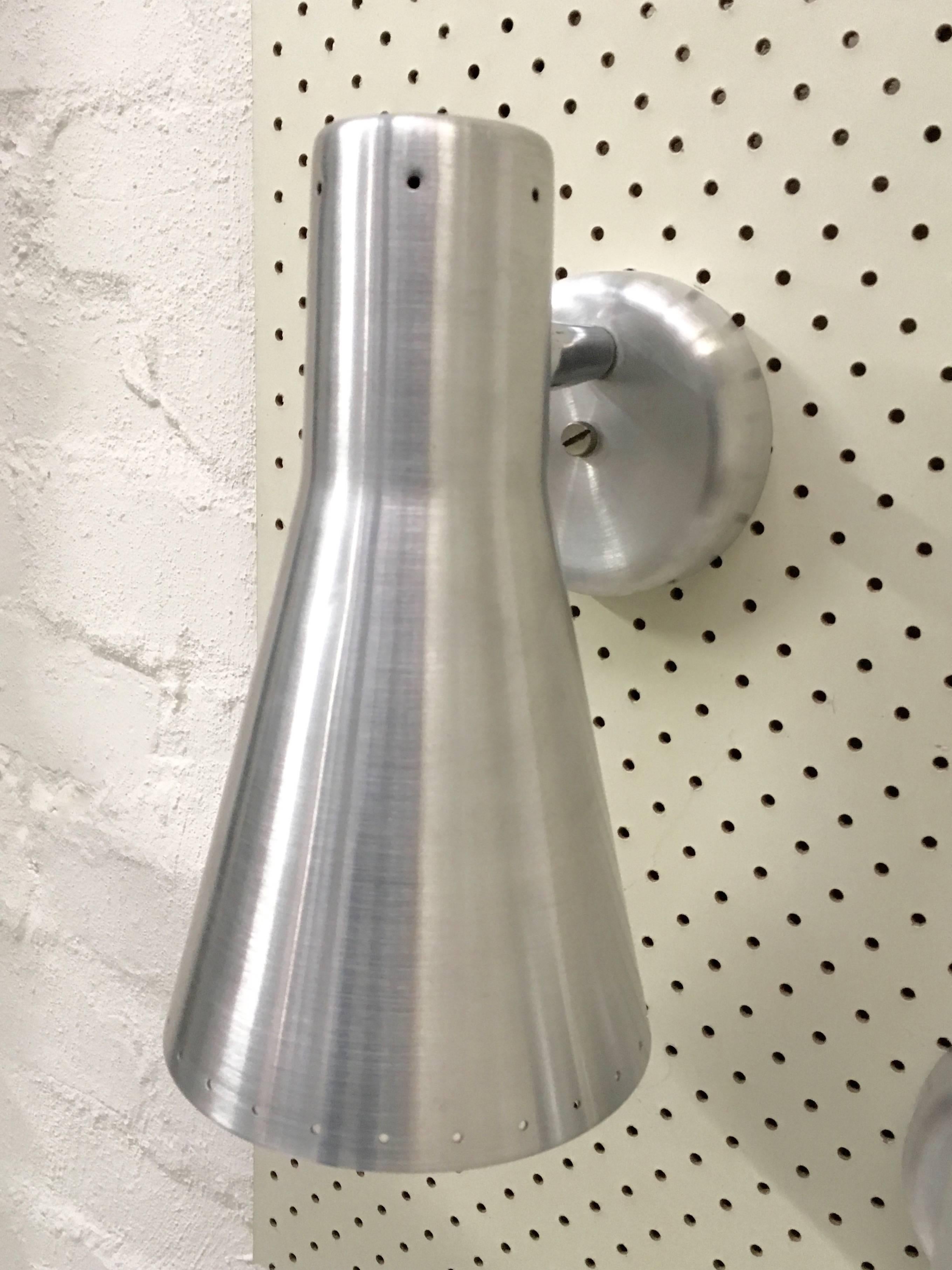 A fab pair of wall lights produced by Australia's foremost designer of architectural lighting in the 1950s and 1960s, Donald Brown of BECO Lighting. They are in great condition, fully restored and rewired. 

Australian collectors and home owners