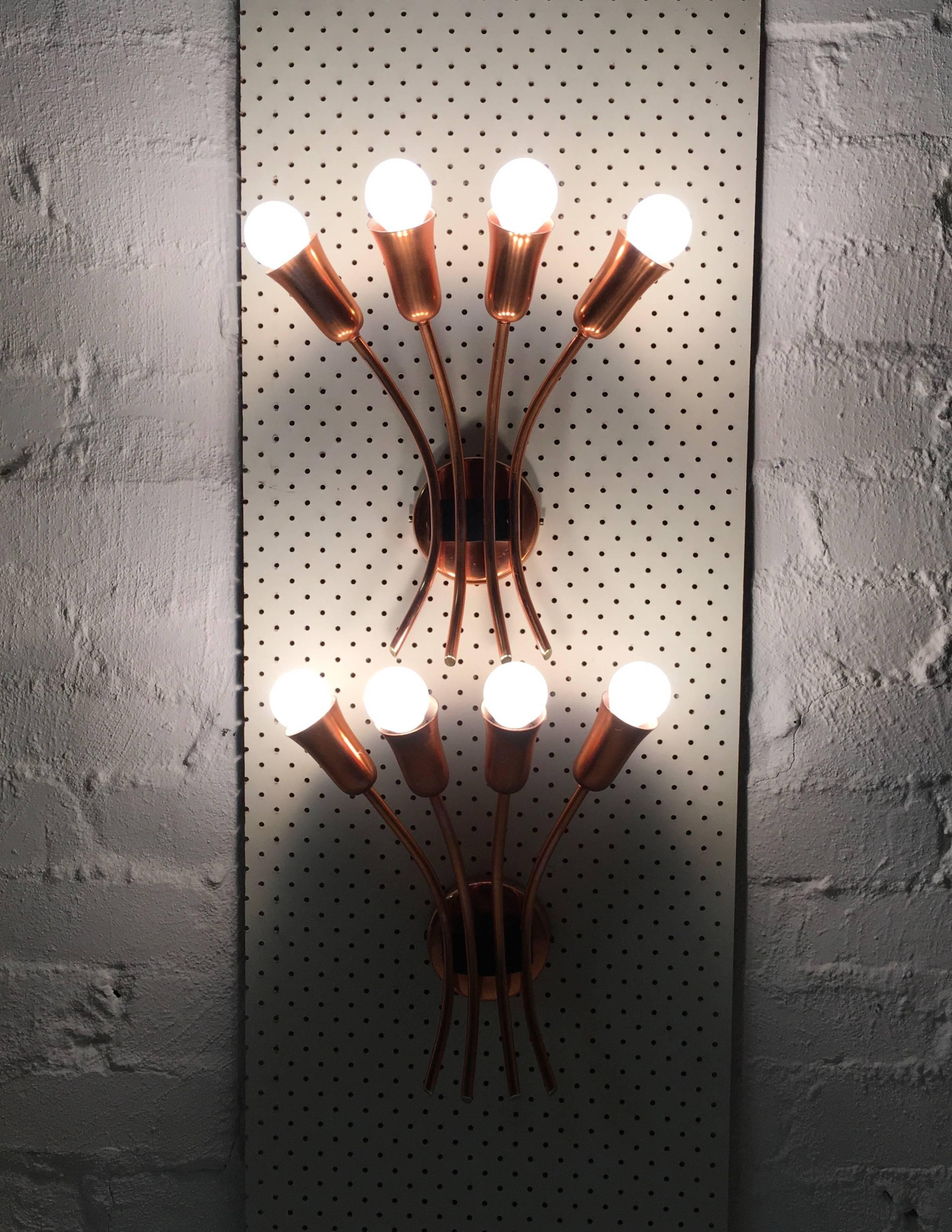 This magnificent pair of copper wall sconces in the style of Stilnovo was a private commission for a 1950s Melbourne architectural project in Caulfield. The lighting was designed and produced by Brown Evans and Co. (BECO) in close consultation with