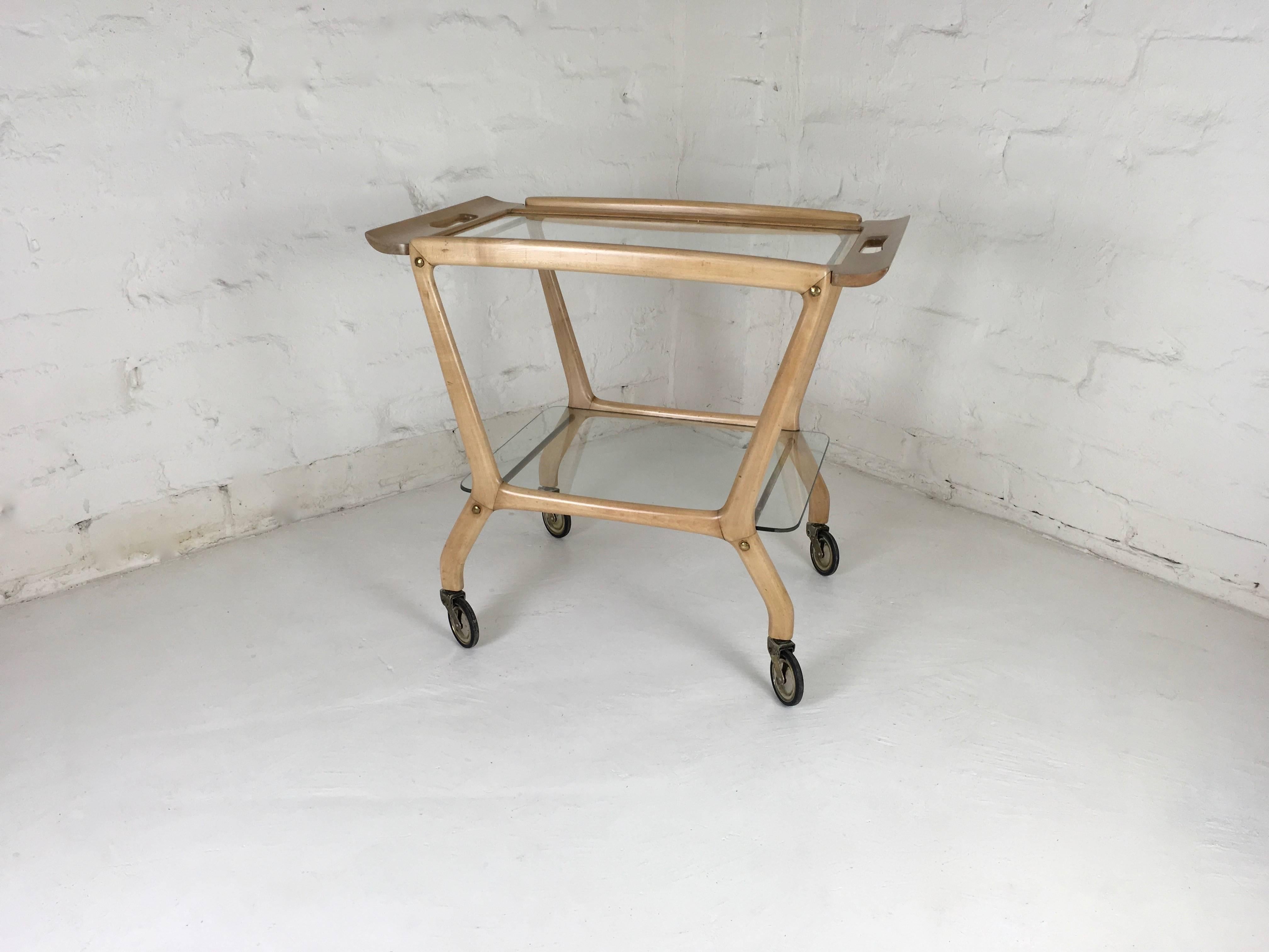 Roll on 6 o'clock! This lovely bar cart will make your cocktail time a delight. Beautifully designed, elegant, yet sturdy. The top tier of the cart has a removable serving tray with Asiatic style upturned ends - a lovely item in it's own right. The