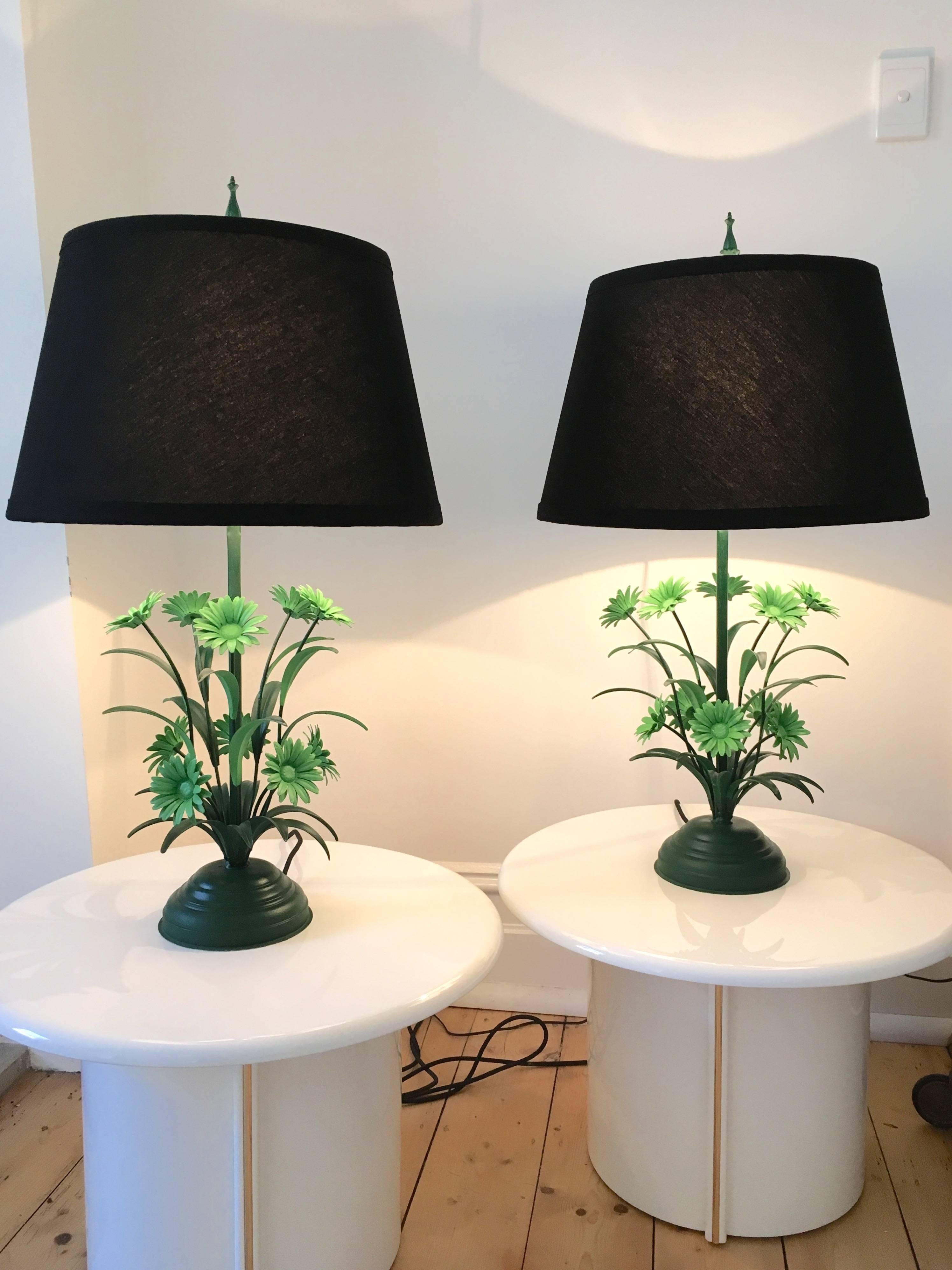A sweet pair of toleware Daisy table lamps that offer charm and sophistication in equal parts. The bases push a little into the realm of kitsch with their twin-tone mint and Amsterdam green leaves and flowers. The metalwork pings off the low-fi